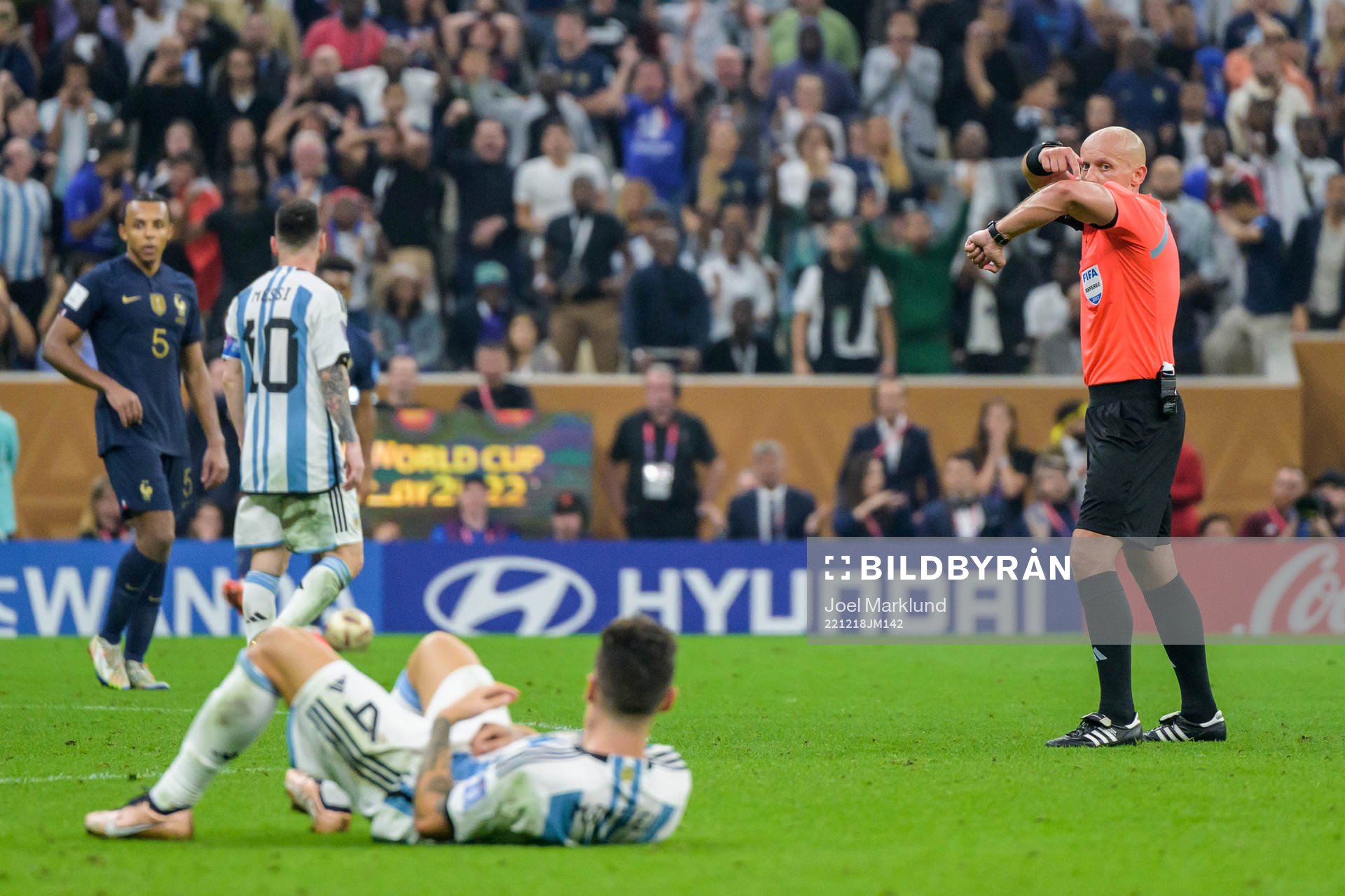 referee Szymon Marciniak signals for a penalty shot for
