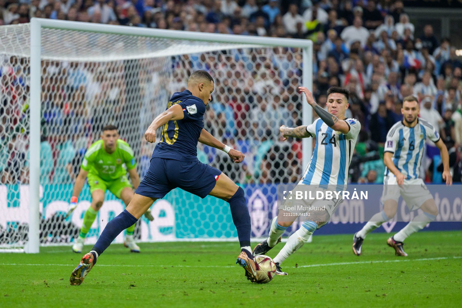 Kylian Mbappe of France and Enzo Fernandez of Argentina