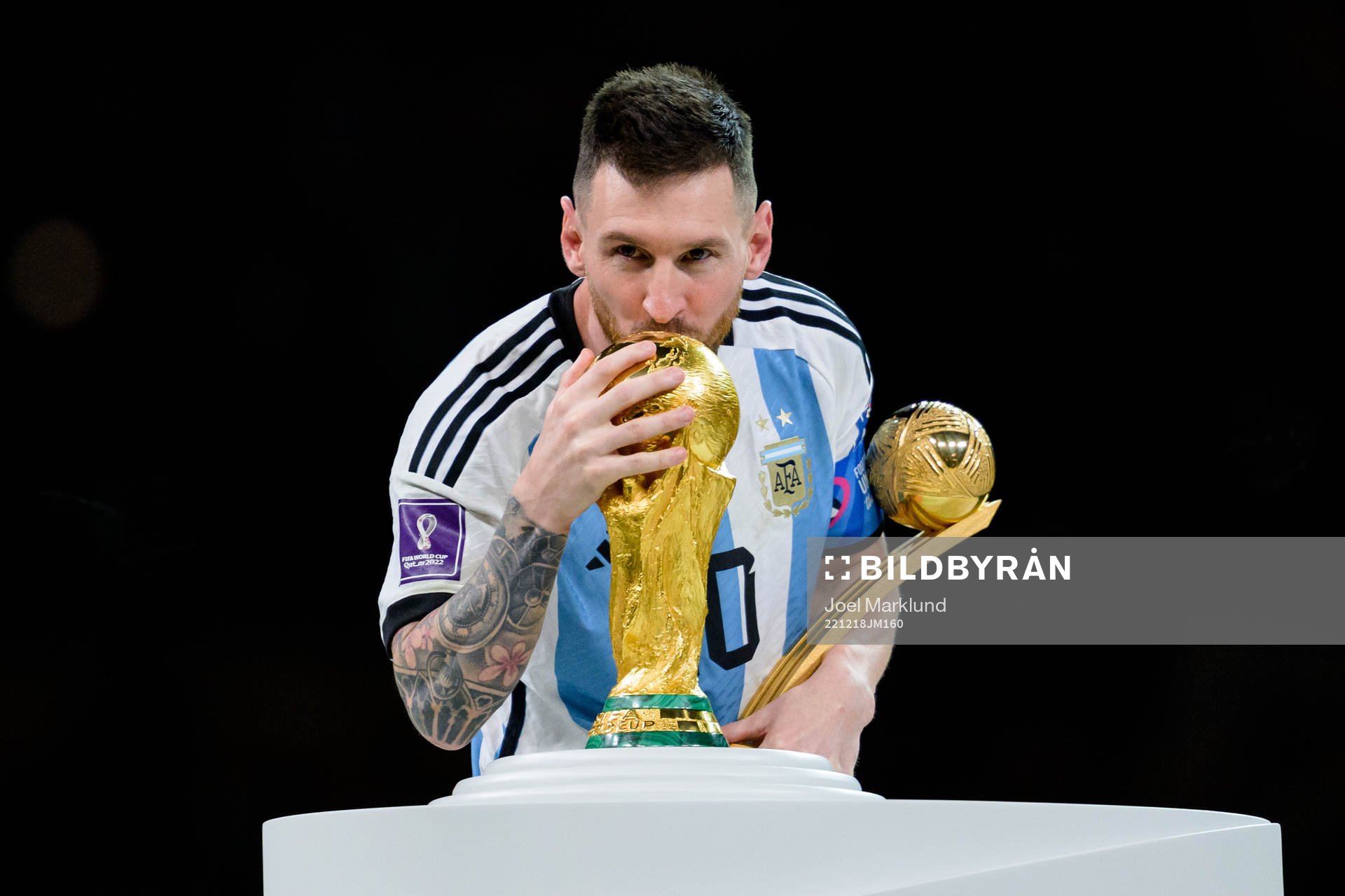 Lionel Messi of Argentina kisses the FIFA World Cup Trophy