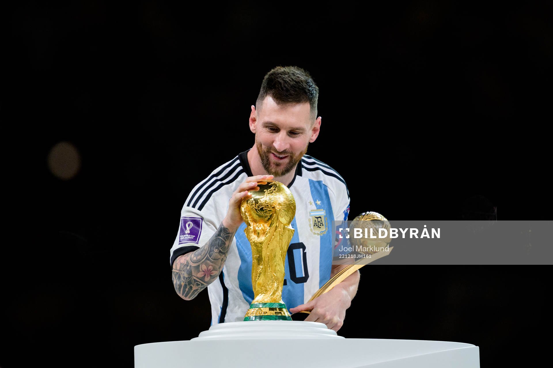 Lionel Messi of Argentina with the FIFA World Cup Trophy