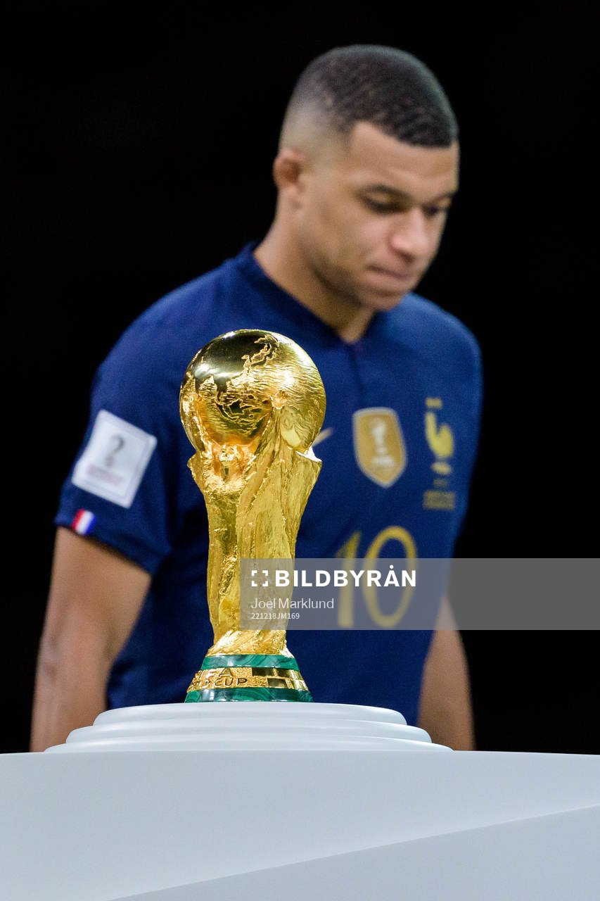 Kylian Mbappe of France looks dejected next to the FIFA