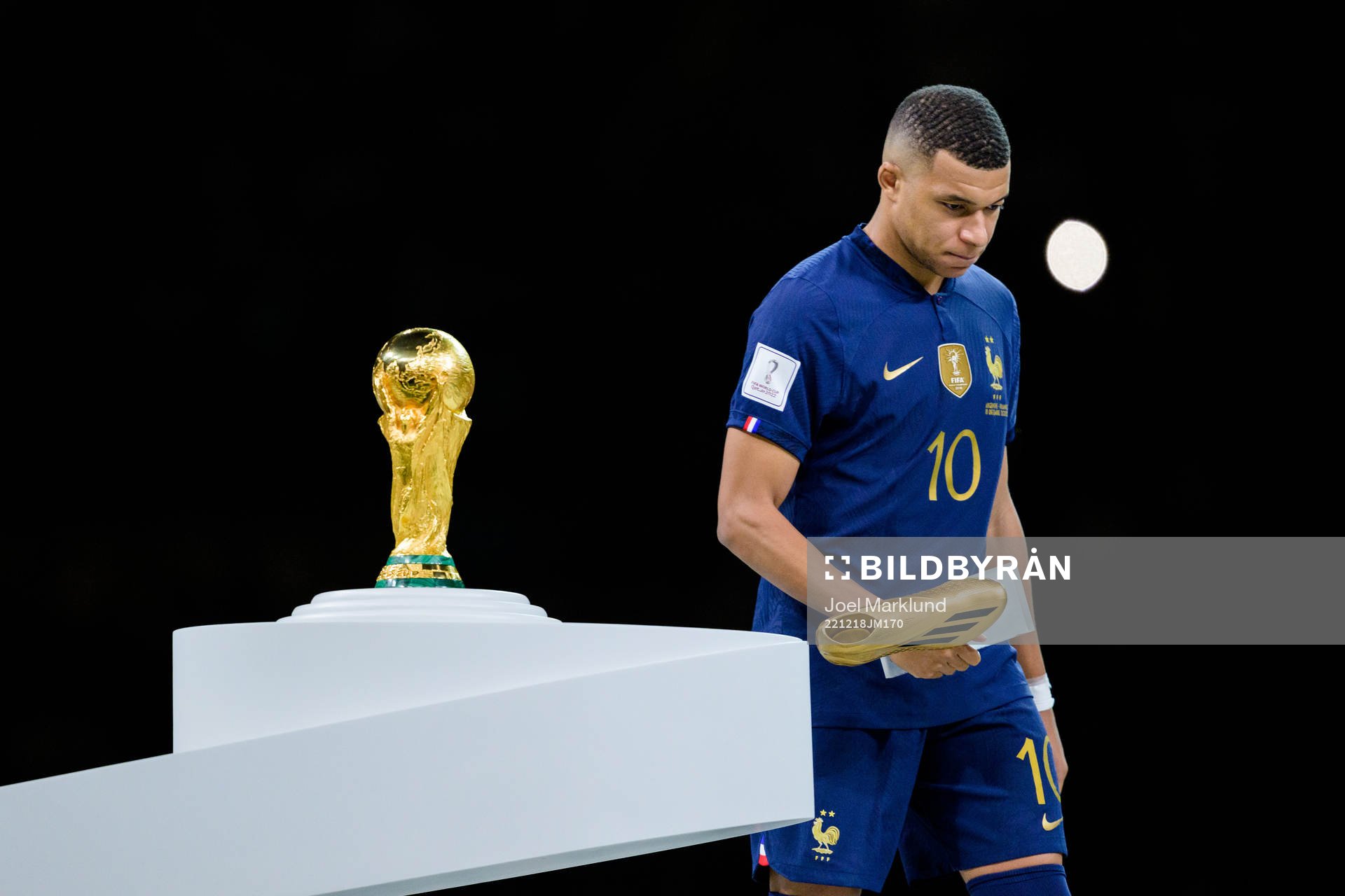 Kylian Mbappe of France looks dejected next to the FIFA