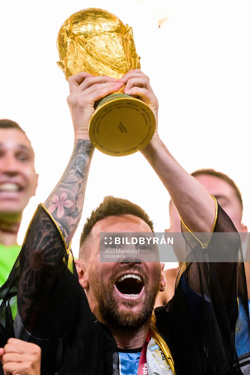 Lionel Messi of Argentina lifts the FIFA World Cup Trophy