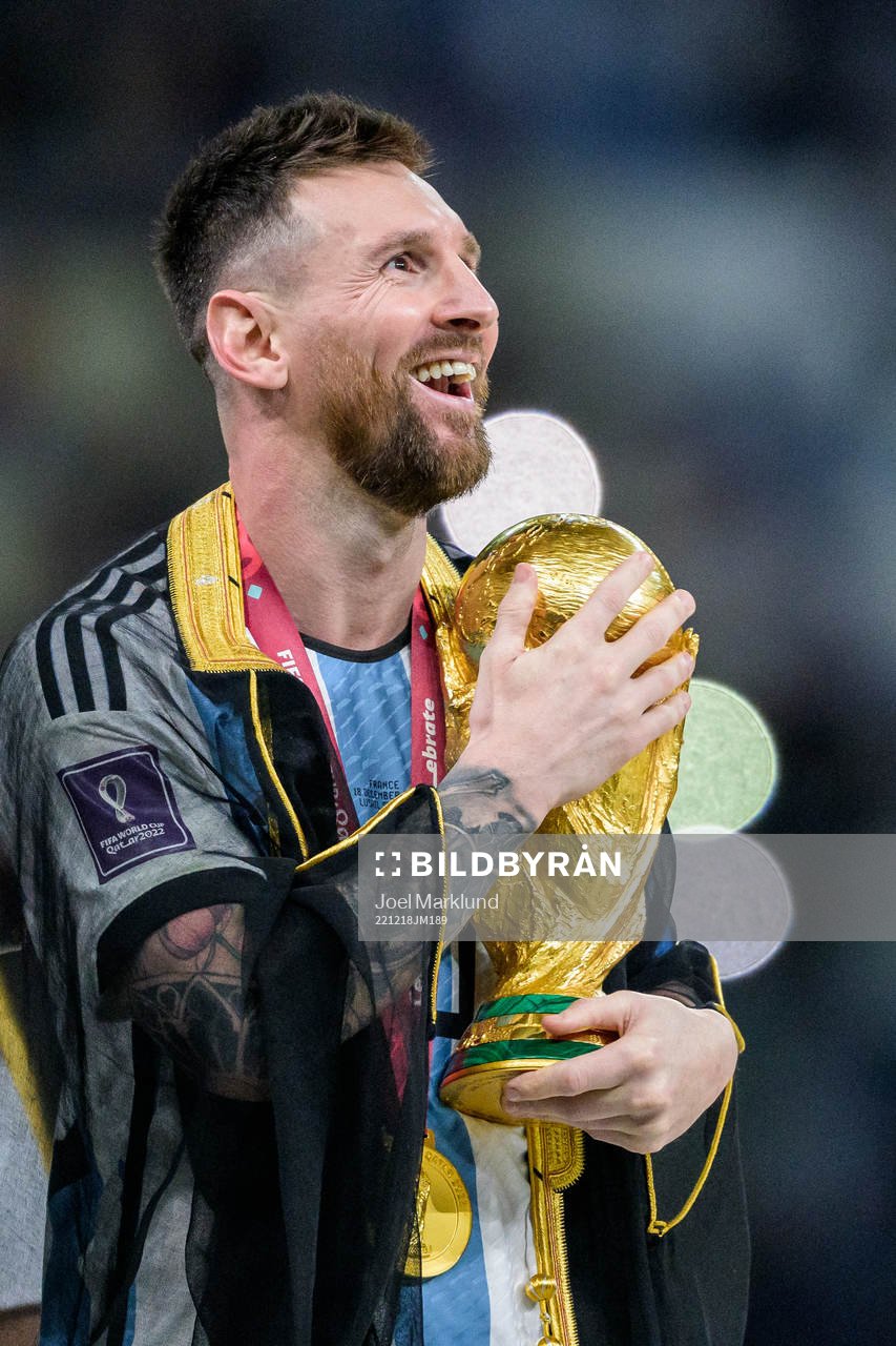 Lionel Messi of Argentina with FIFA World Cup Trophy