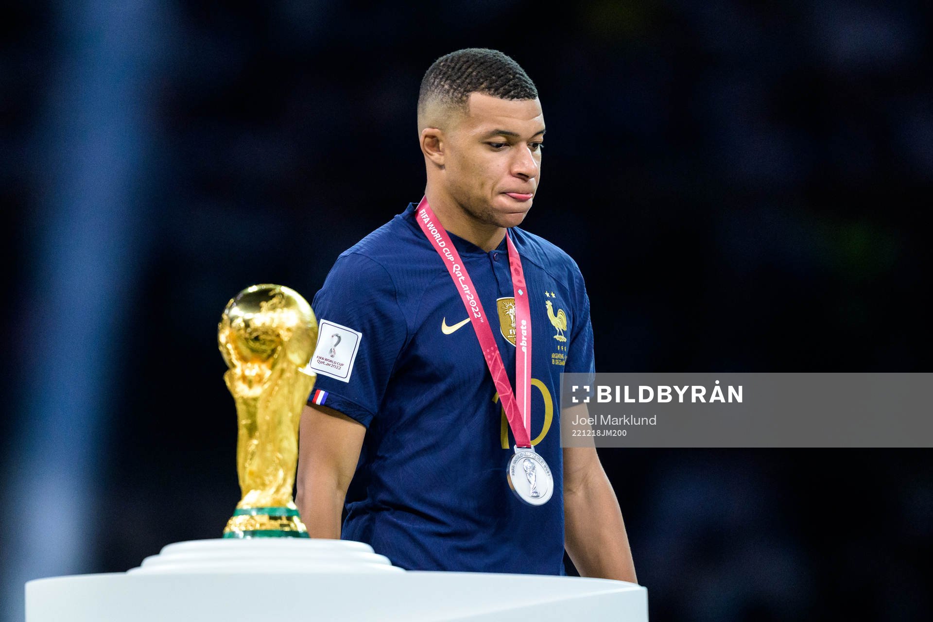 Kylian Mbappe of France looks dejected as he is passing the