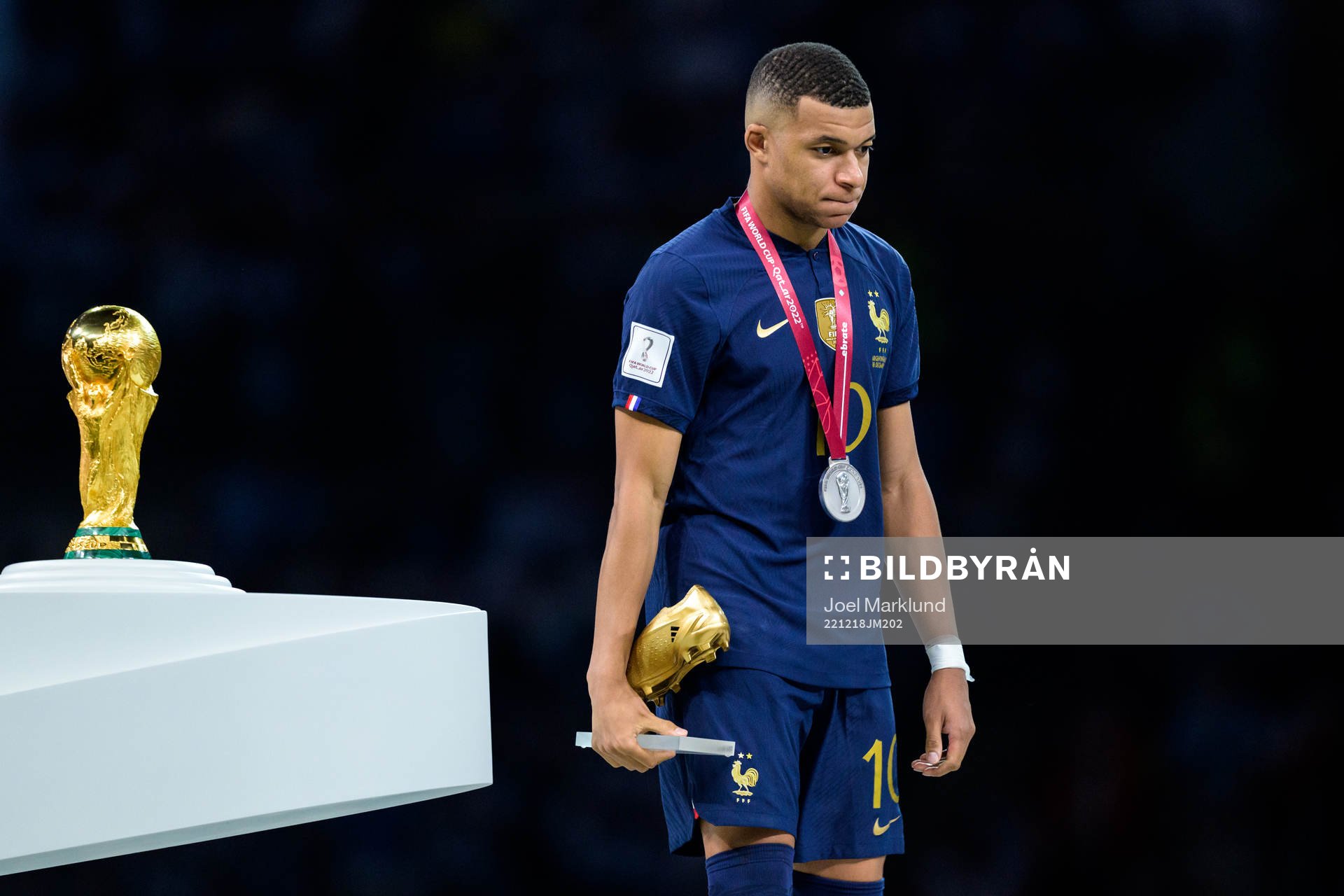 Kylian Mbappe of France looks dejected as he is passing the