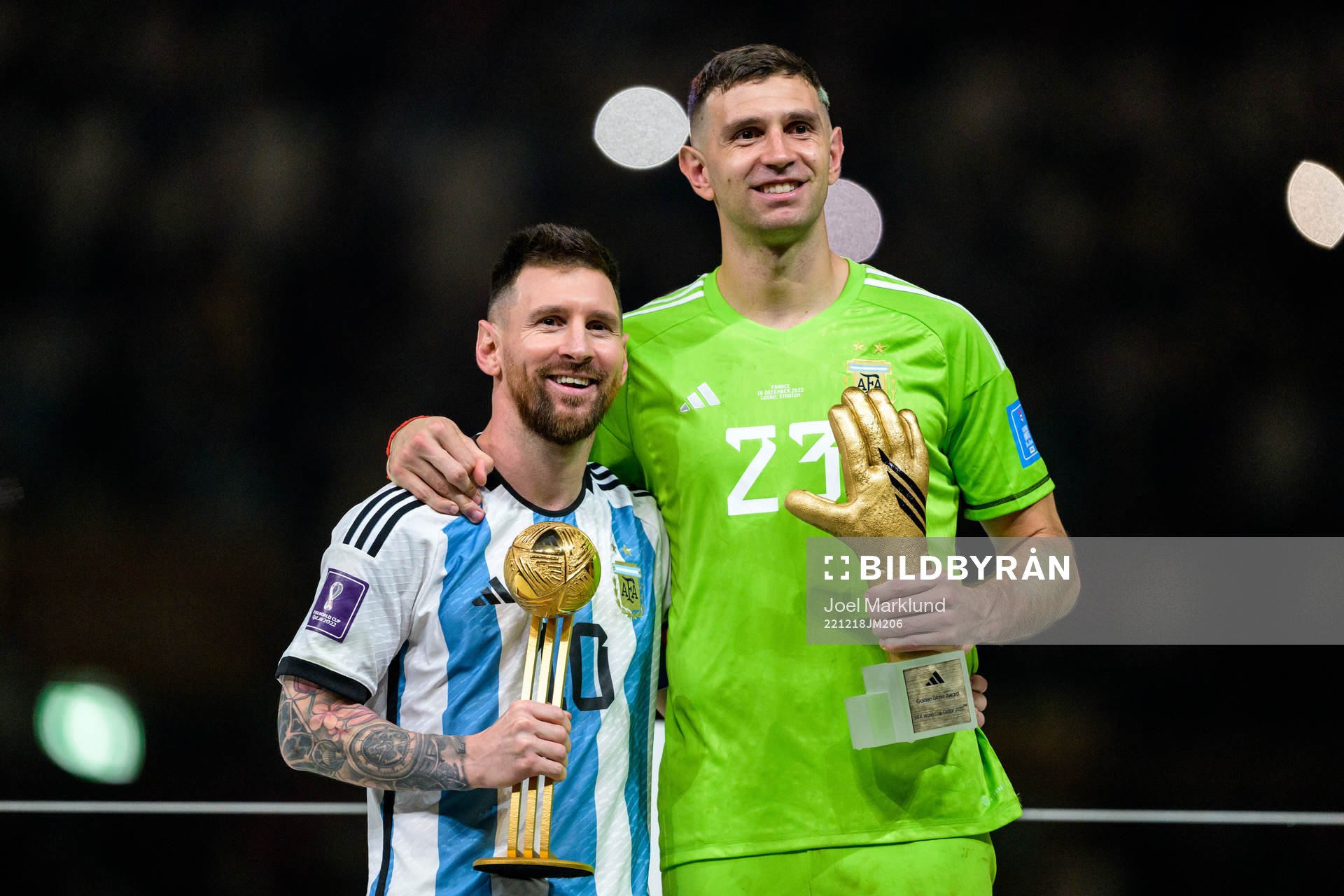 Lionel Messi and goalkeeper Emiliano Martinez of Argentina