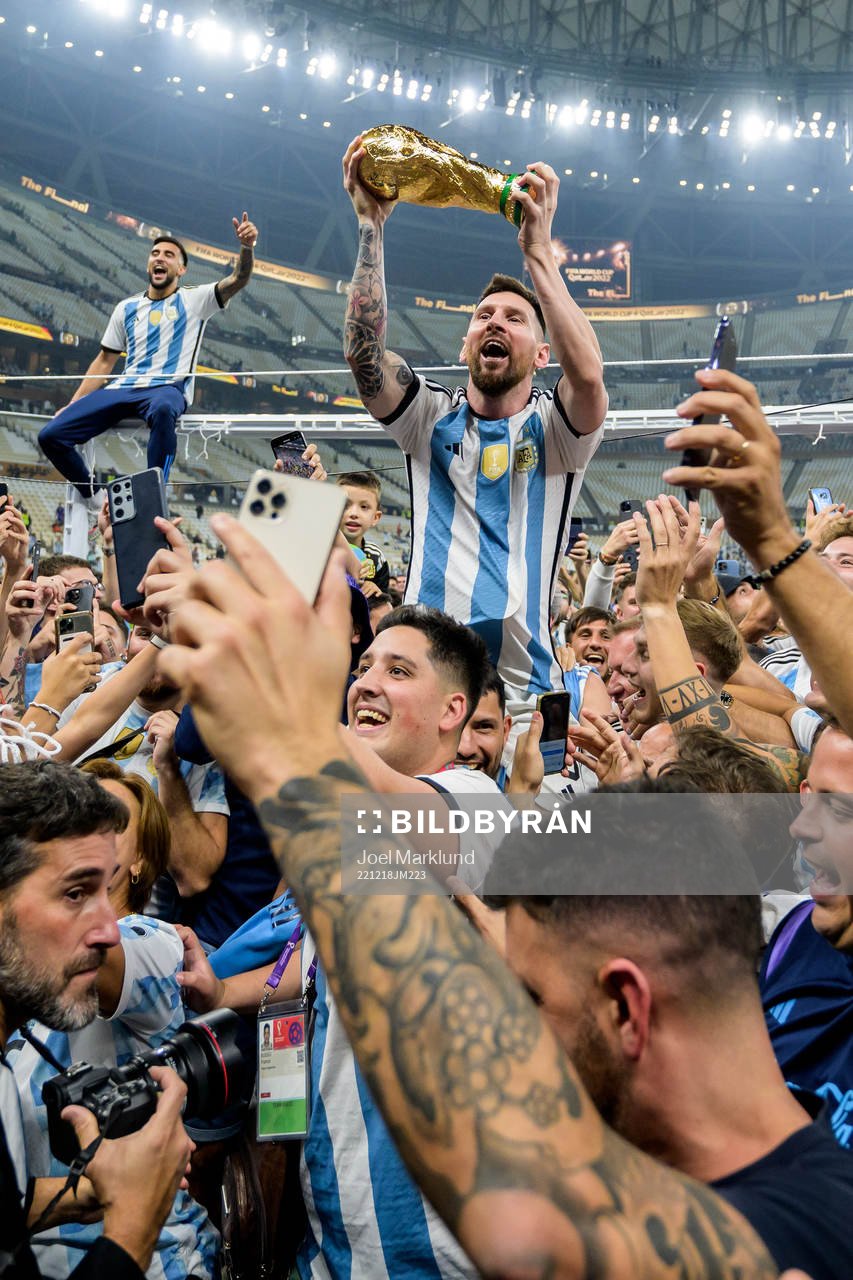 Lionel Messi of Argentina celebrates with the FIFA World