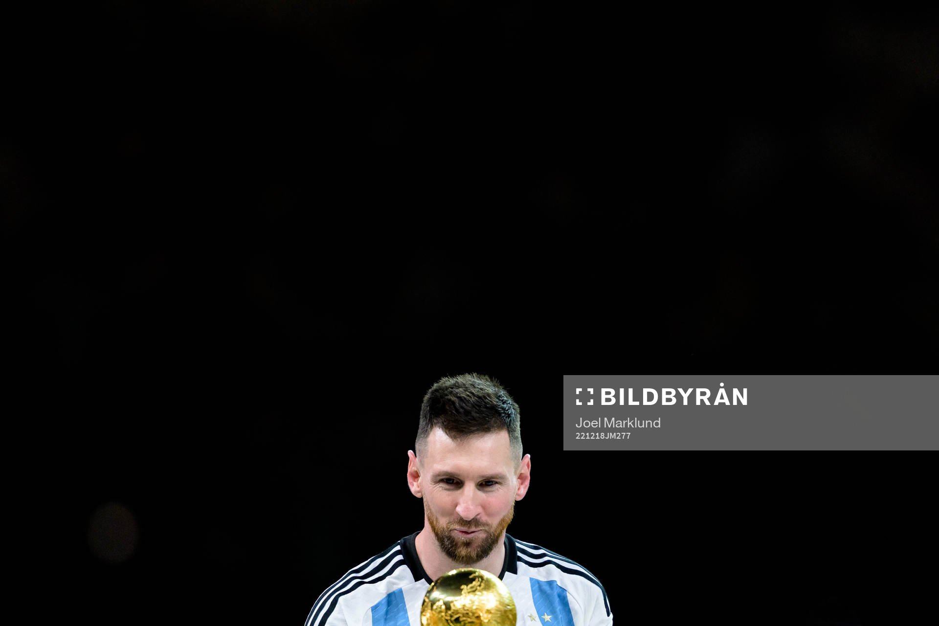 Lionel Messi of Argentina with the FIFA World Cup Trophy