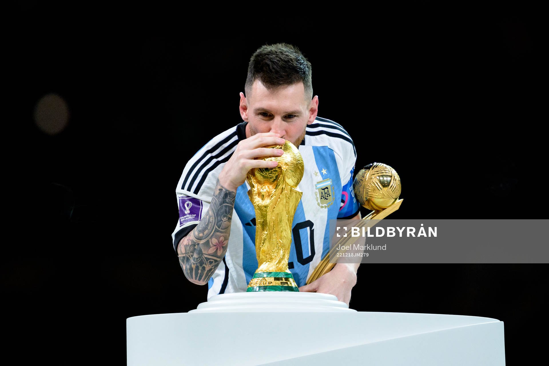 Lionel Messi of Argentina kisses the FIFA World Cup Trophy