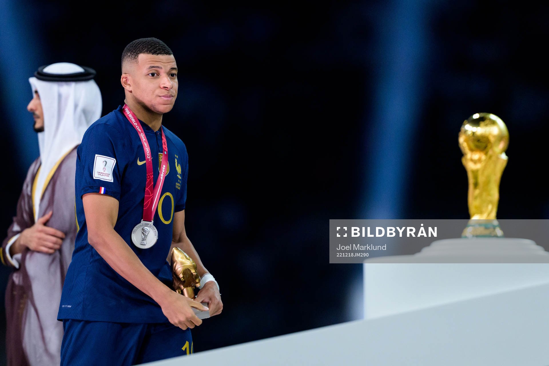 Kylian Mbappe of France looks dejected as he passes the