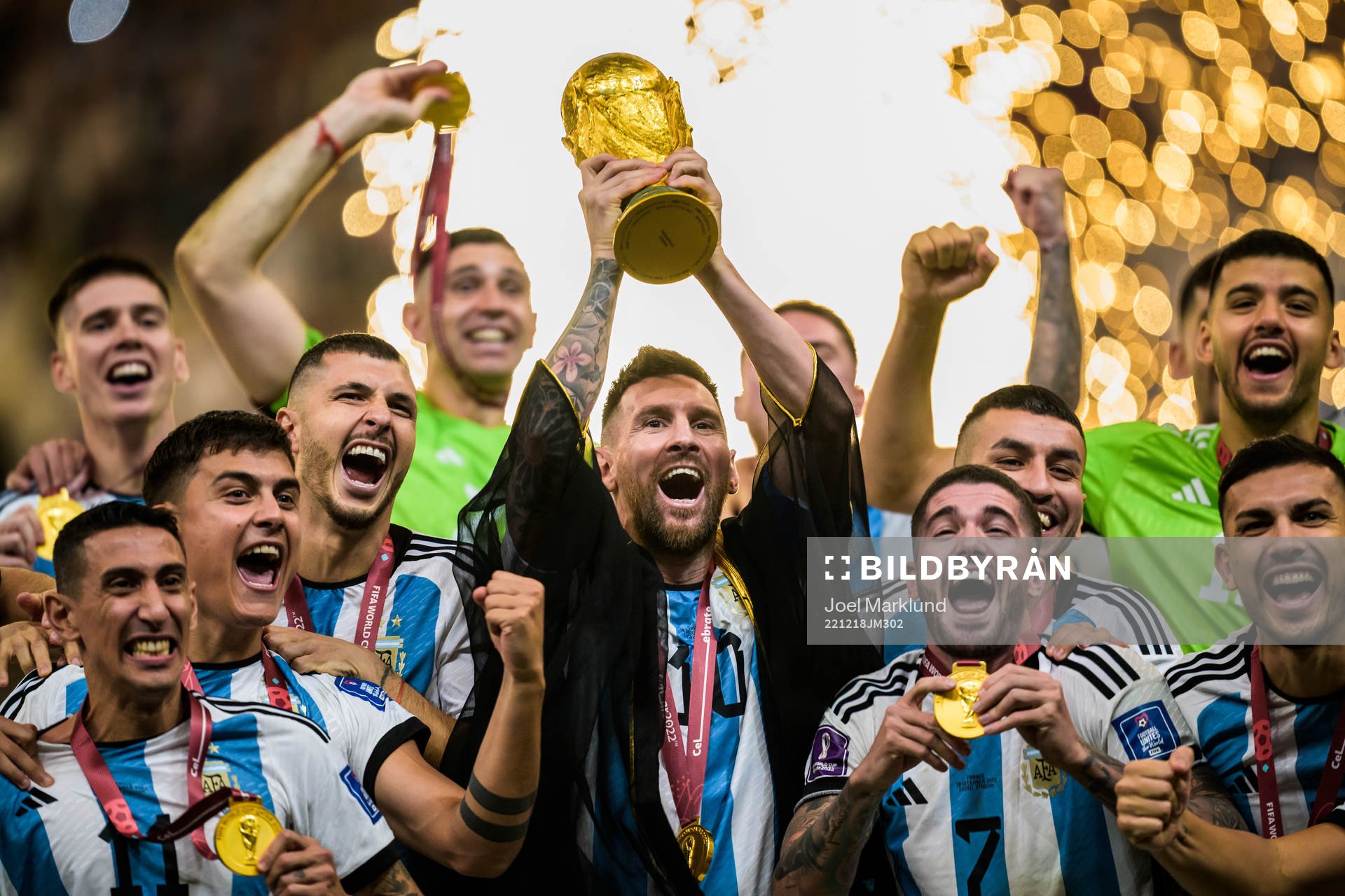 Lionel Messi of Argentina hoists the World Cup trophy as