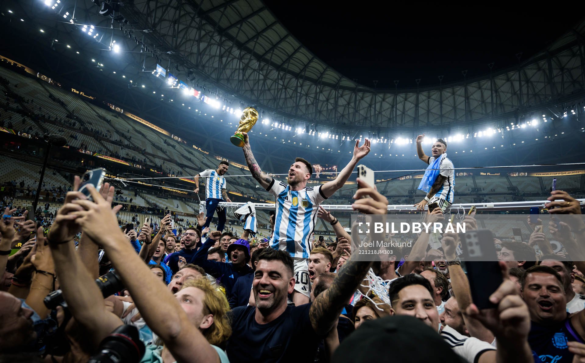 Lionel Messi of Argentina celebrates with the World Cup trophy after winning the FIFA World Cup 2022 final between Argentina and France on December 18, 2022 in Doha.