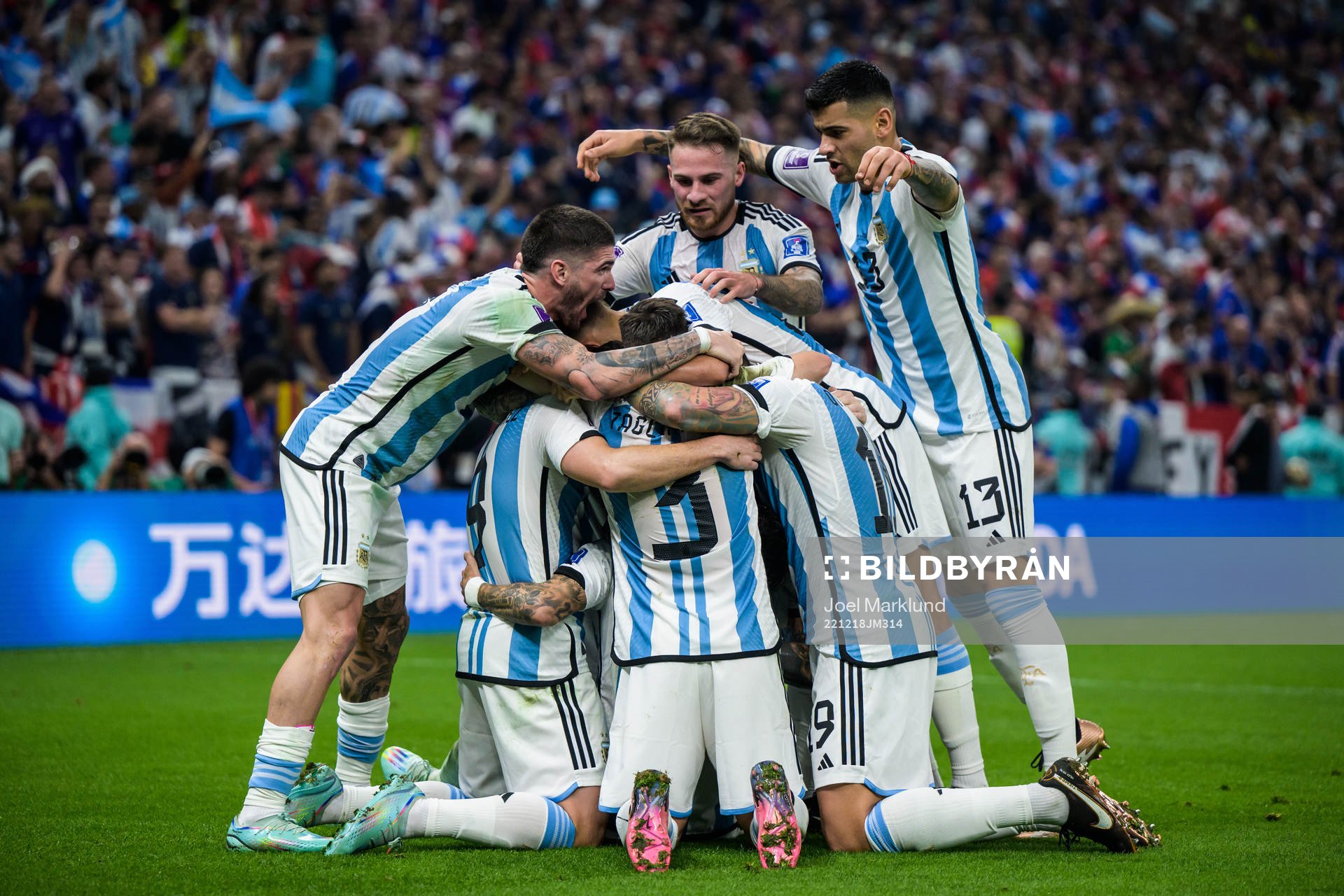 Players of Argentina celebrate the 2-0 goal by Angel de