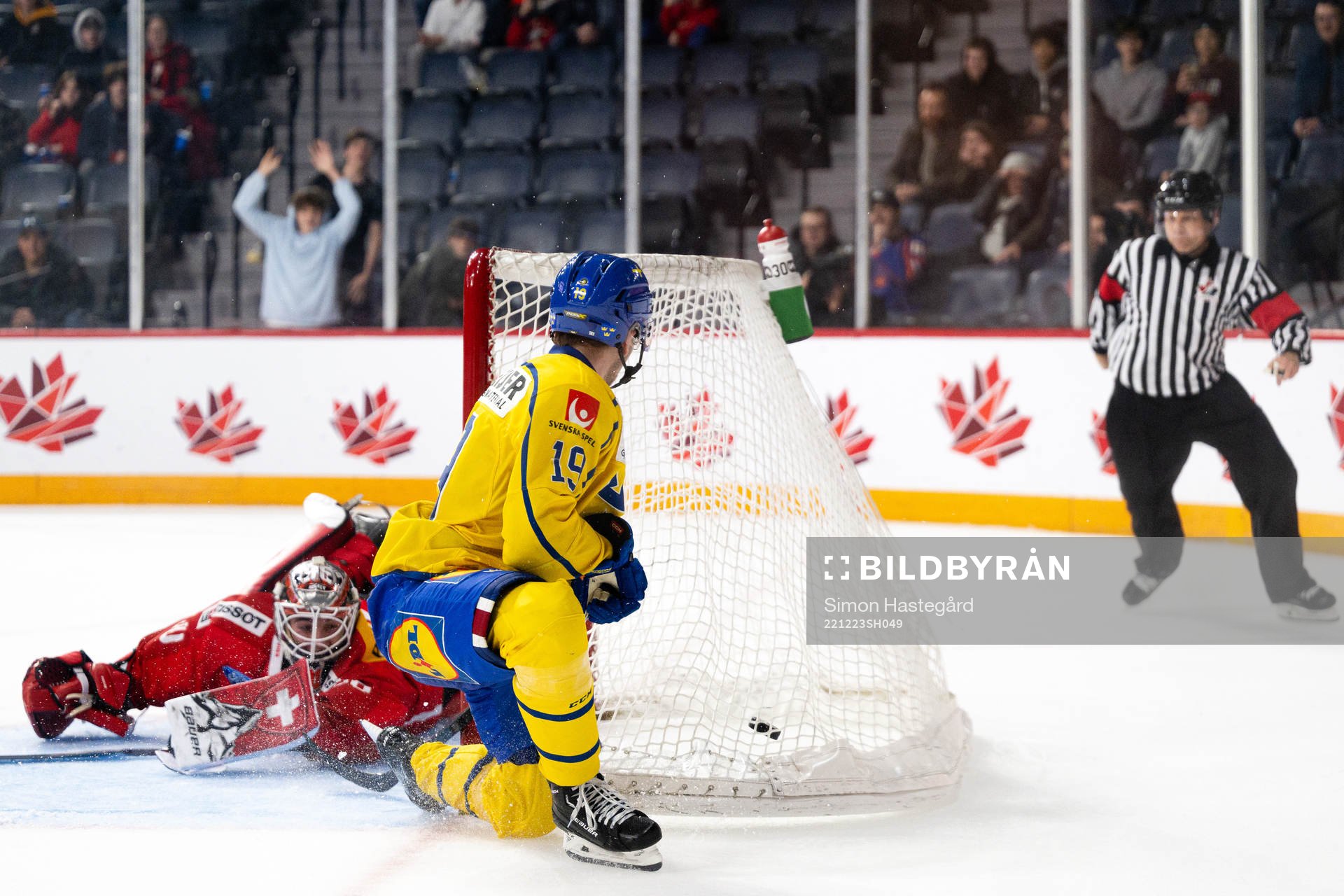 Isak Rosén of Sweden scores a goal behind goaltender Kevin