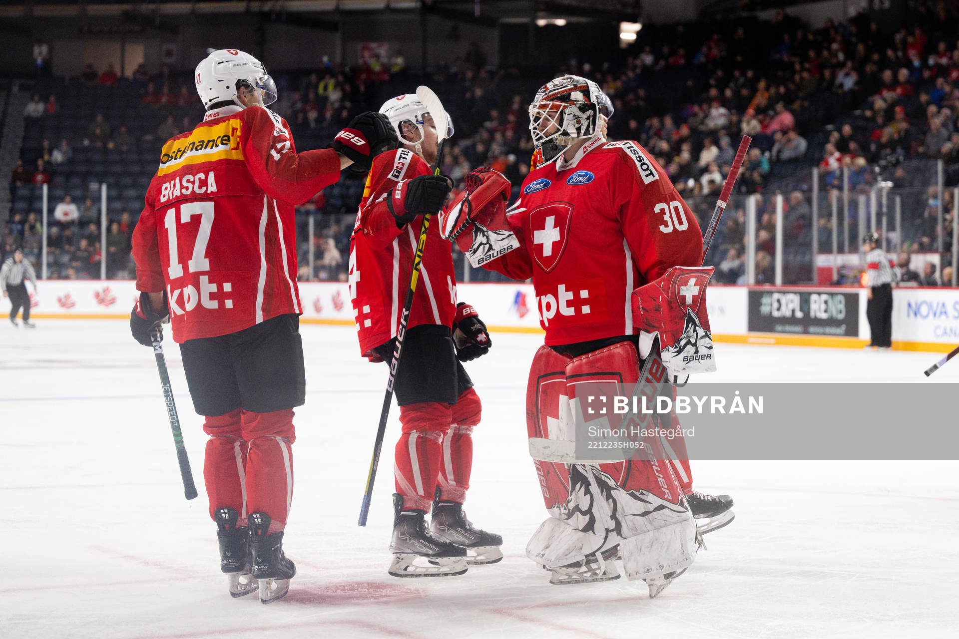 Attilio Biasca and goaltender Kevin Pasche of Switzerland