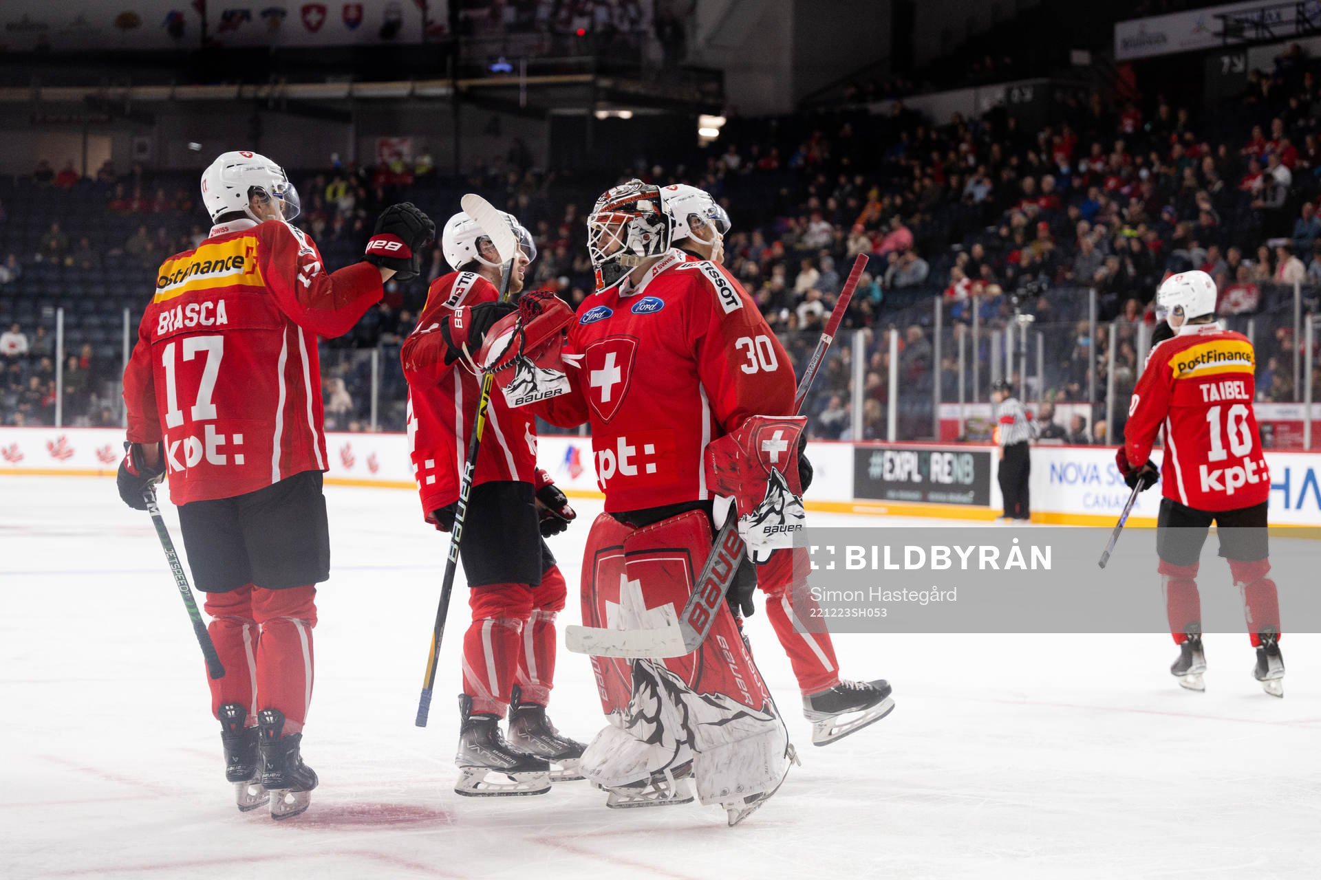 Attilio Biasca and goaltender Kevin Pasche of Switzerland