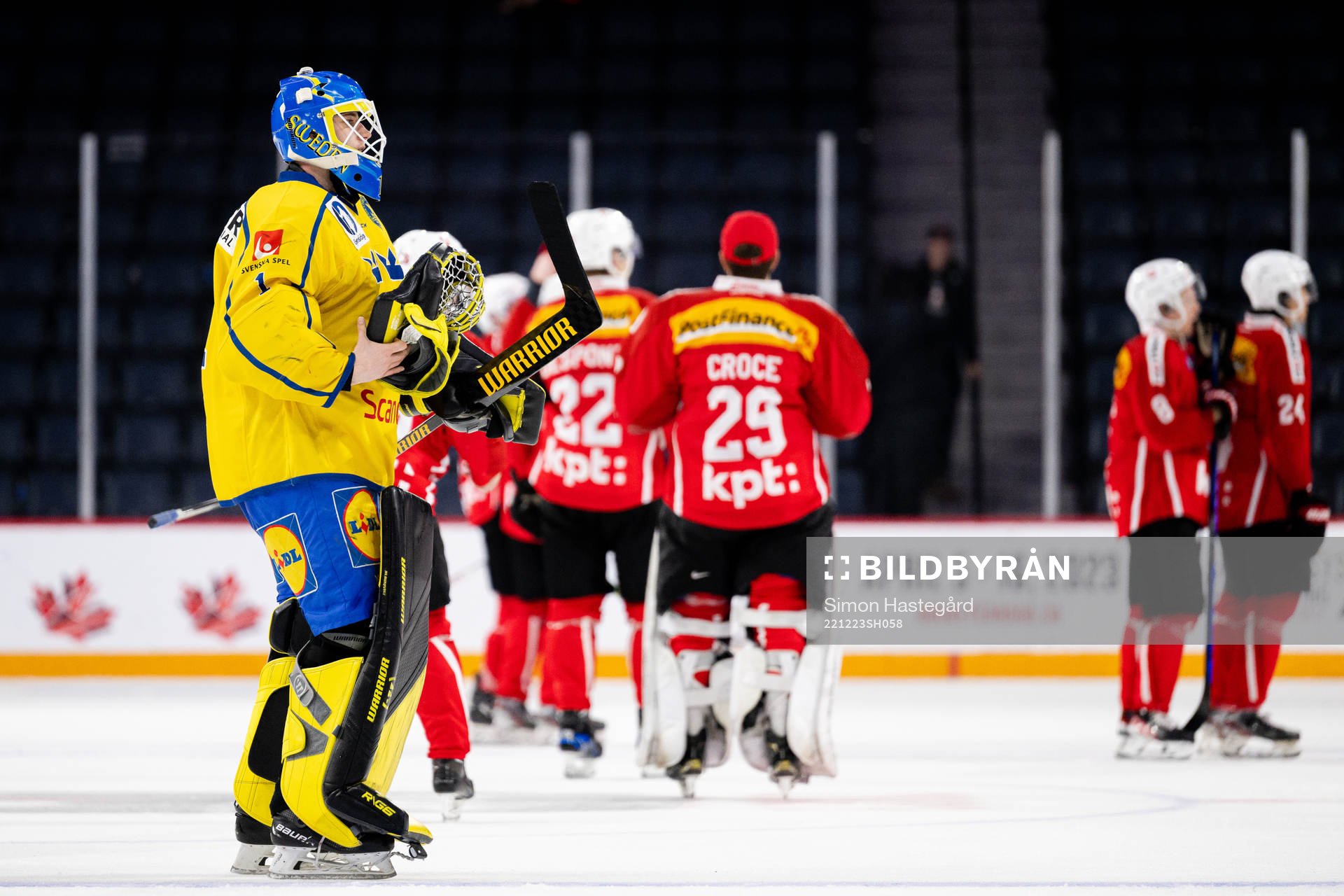 Goaltender Ian Blomquist of Sweden looks dejected