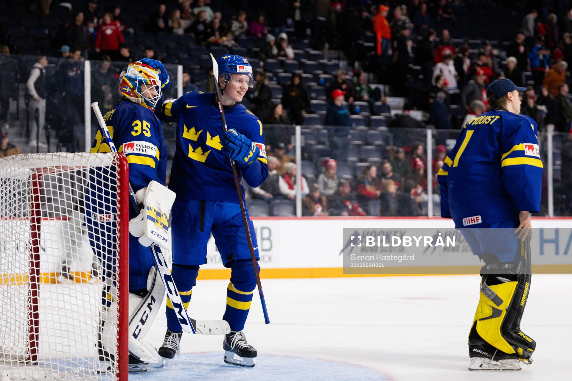 Goaltender Carl Lindbom and Filip Bystedt of Sweden