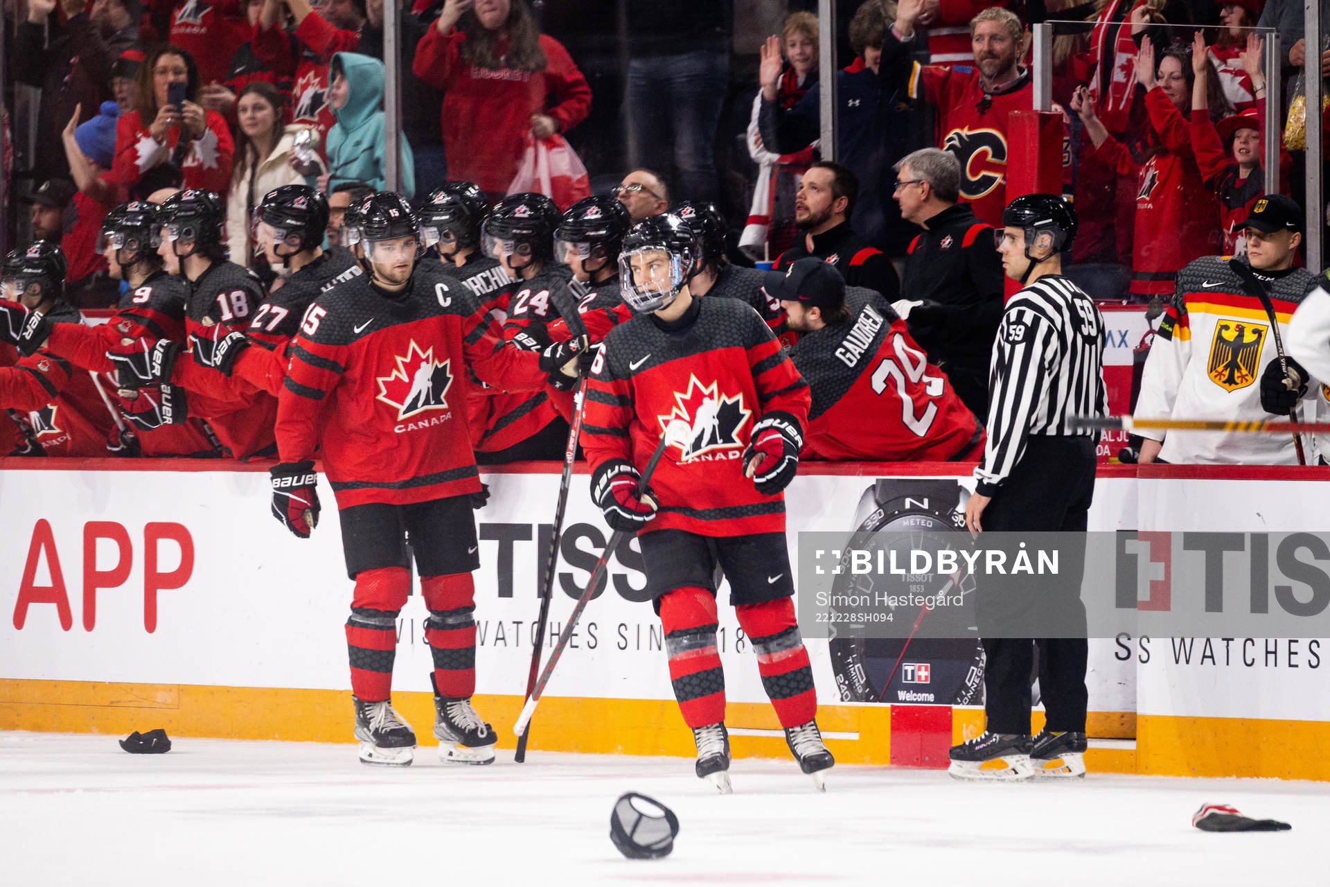 Shane Wright and Connor Bedard of Canada celebrate the 5-1