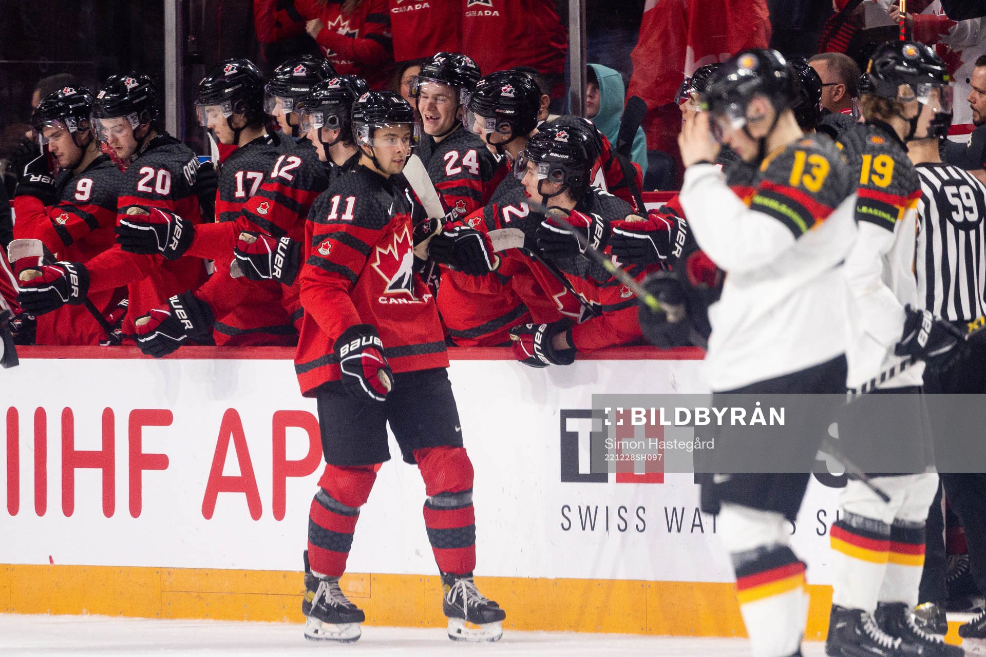 Dylan Guenther of Canada celebrates the 6-1 goal