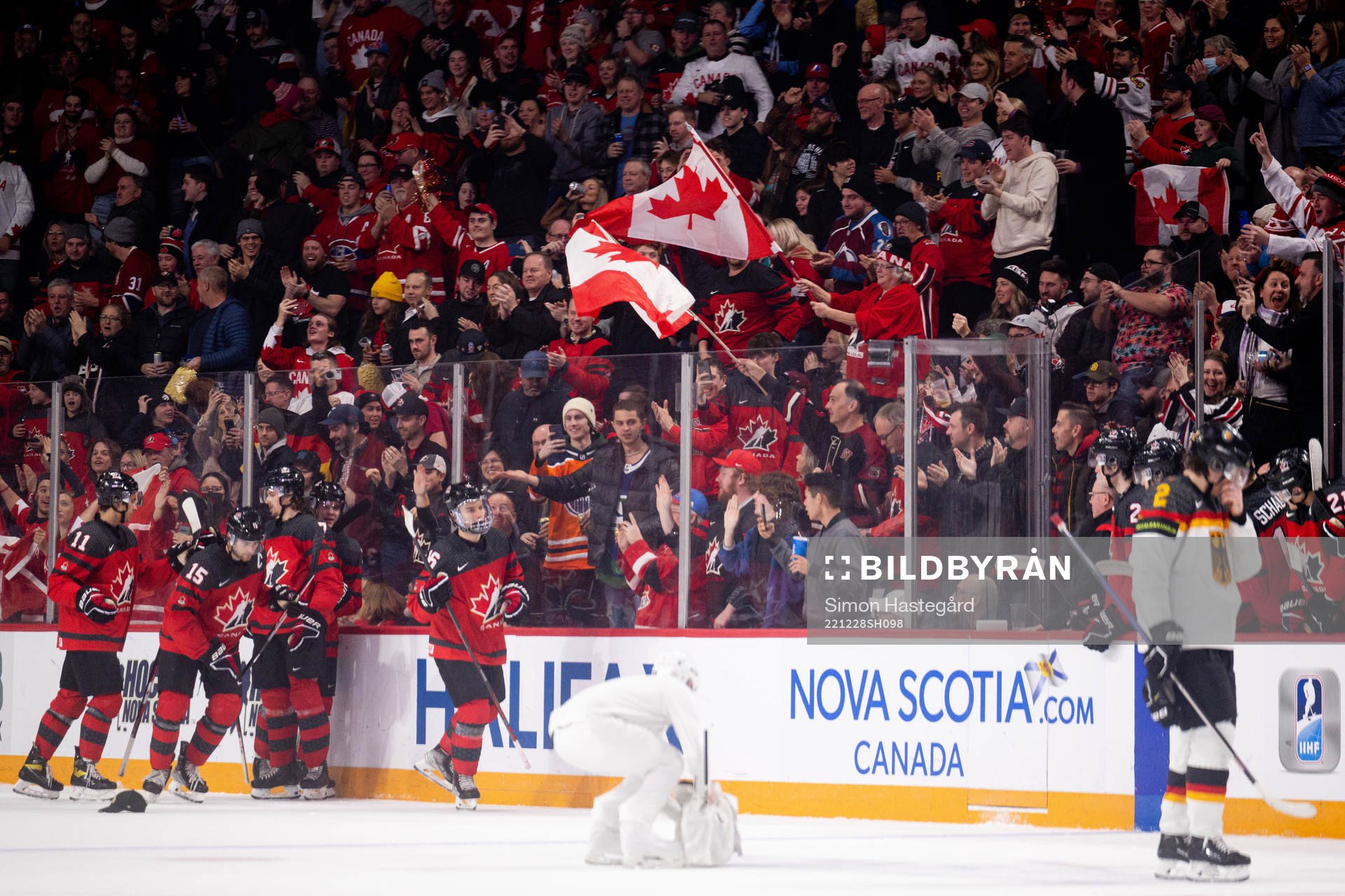 Shane Wright and Connor Bedard of Canada celebrate the 5-1