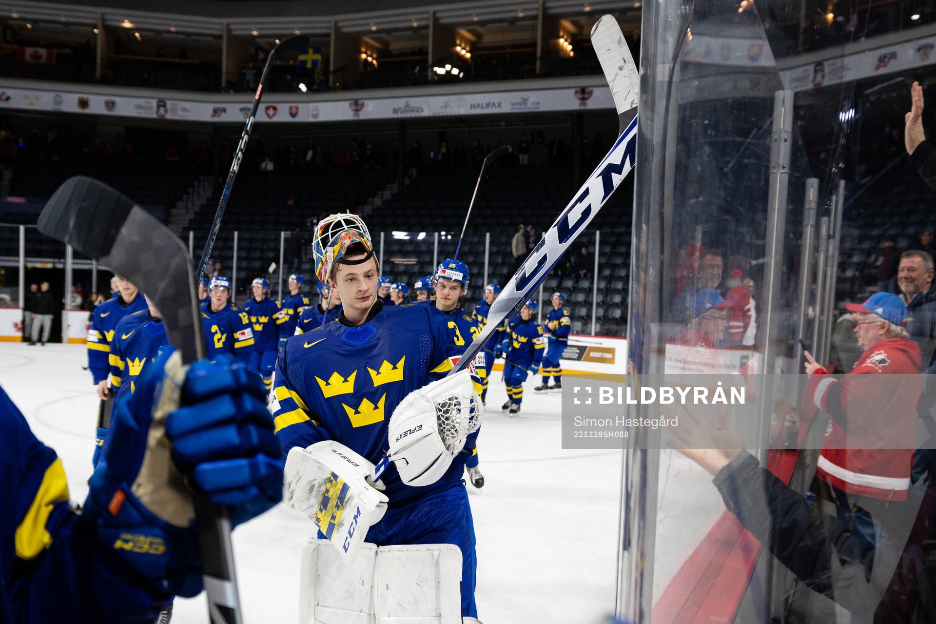 Goaltender Carl Lindbom of Sweden celebrates
