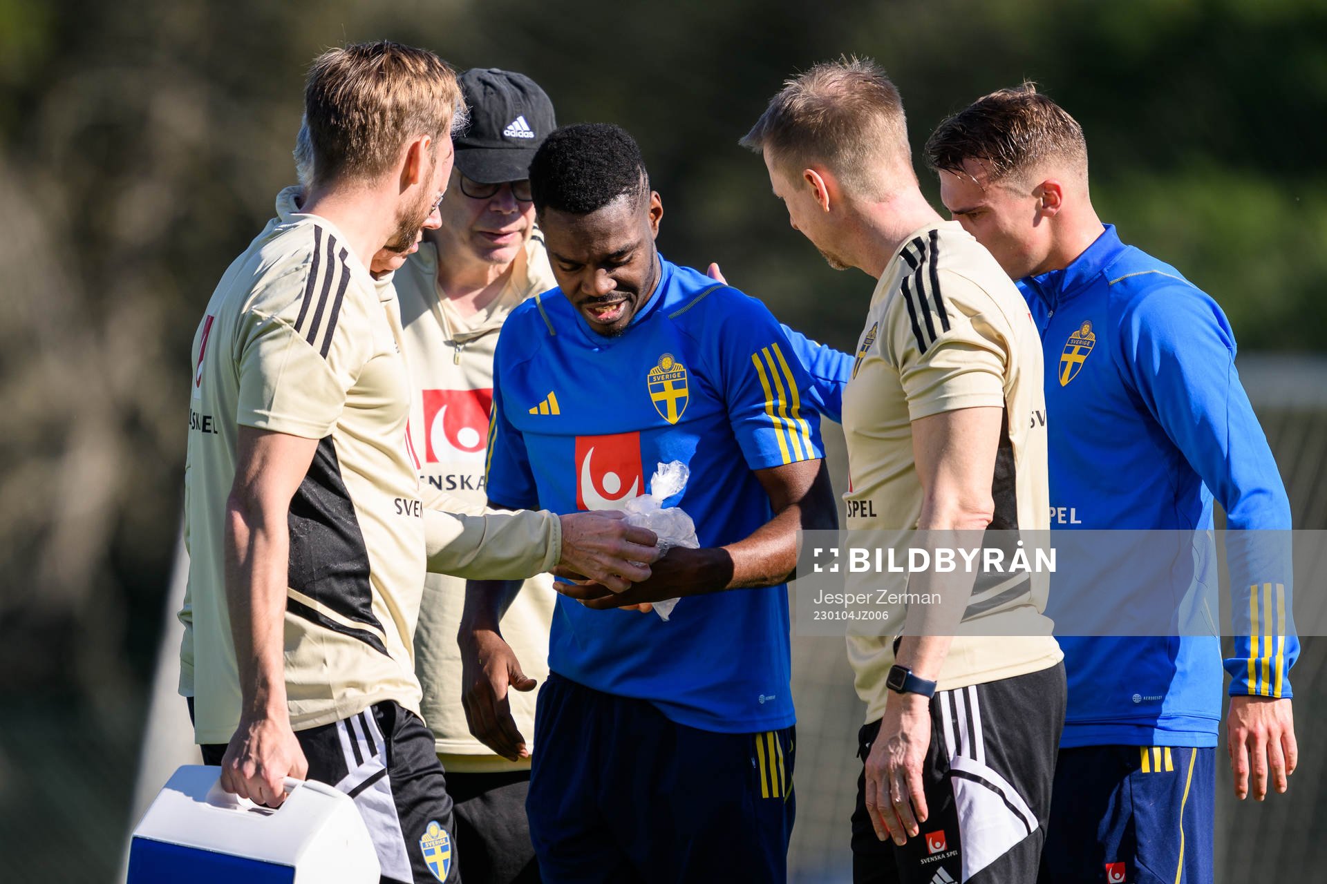 Joel Asoro of the Swedish men's football national team is attended to by medical staff at a training session during the national team on January 4, 2023 in Almacil. 