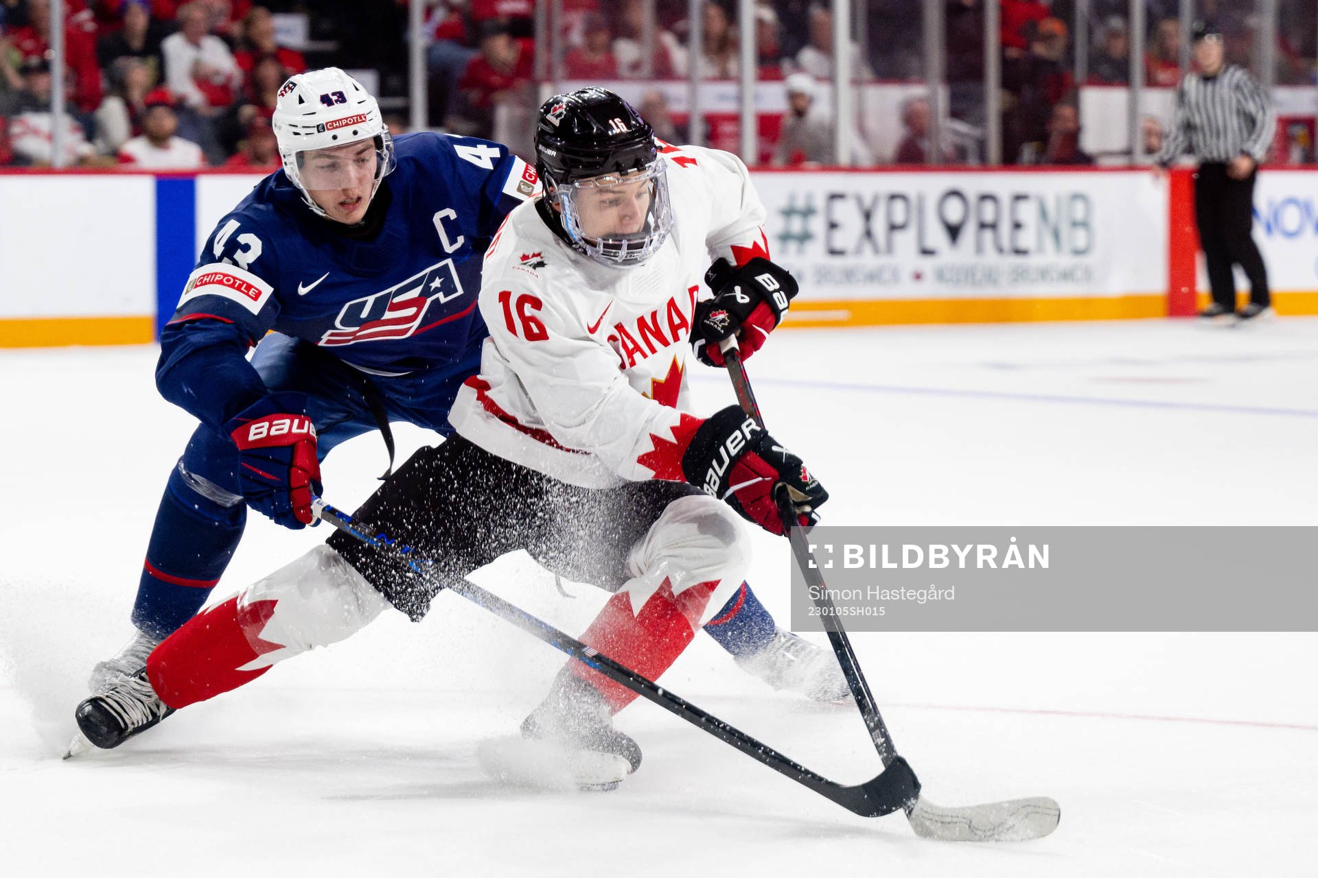 Luke Hughes of USA and Connor Bedard of Canada