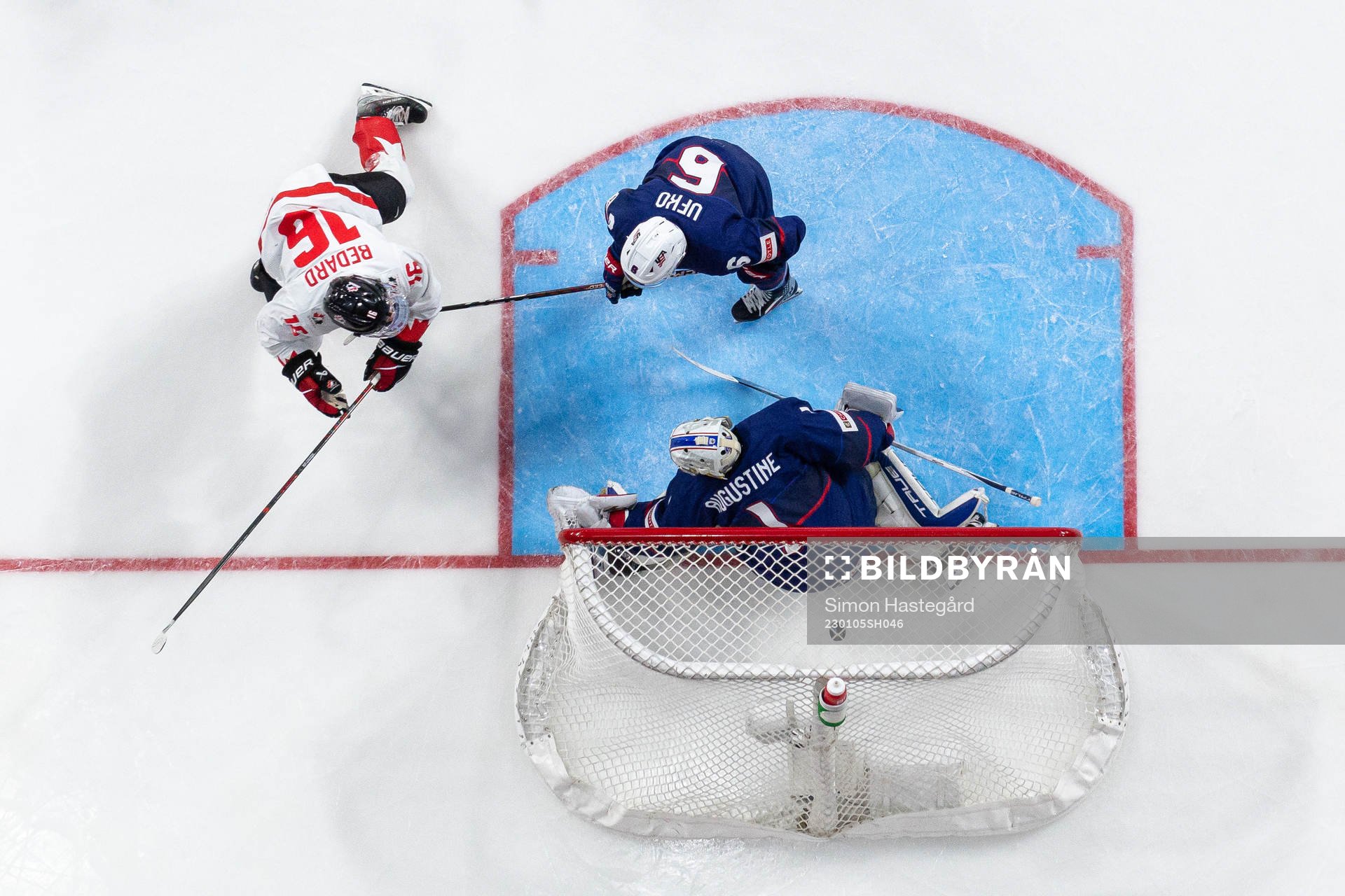 Connor Bedard of Canada scores the 2-1 goal  behind Ryan