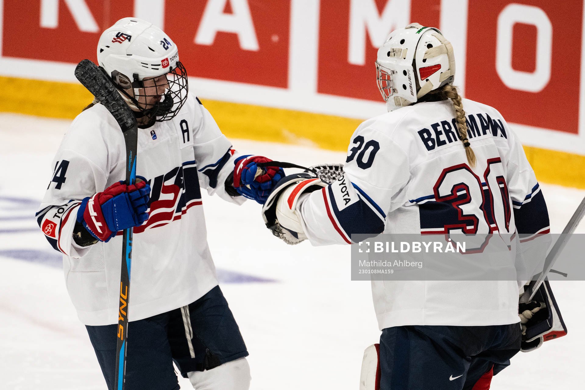 Margaret Scannell and goaltender Annelies Bergmann of USA