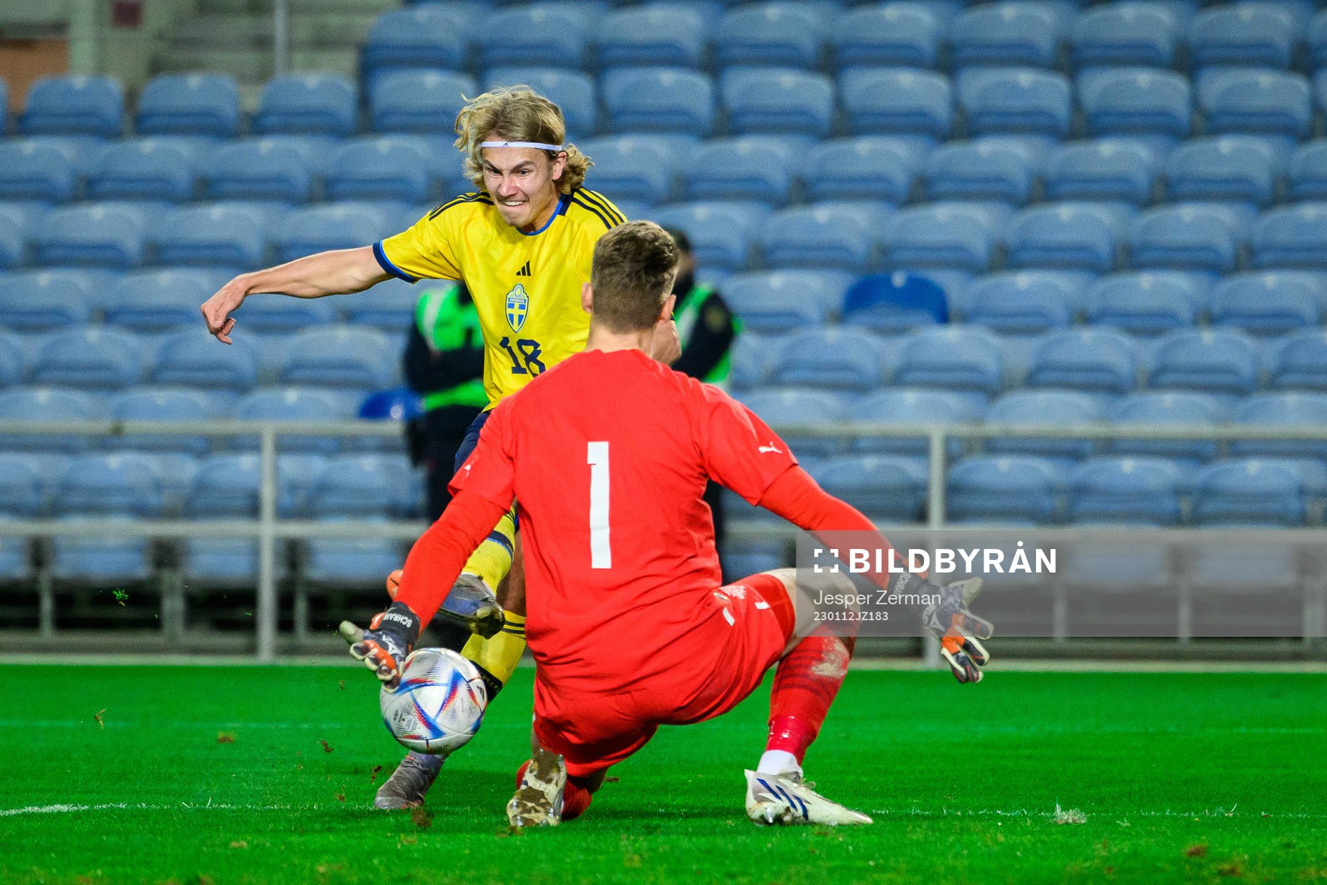 Sebastian Nanasi of Sweden and goalkeeper Fredrik Schram of