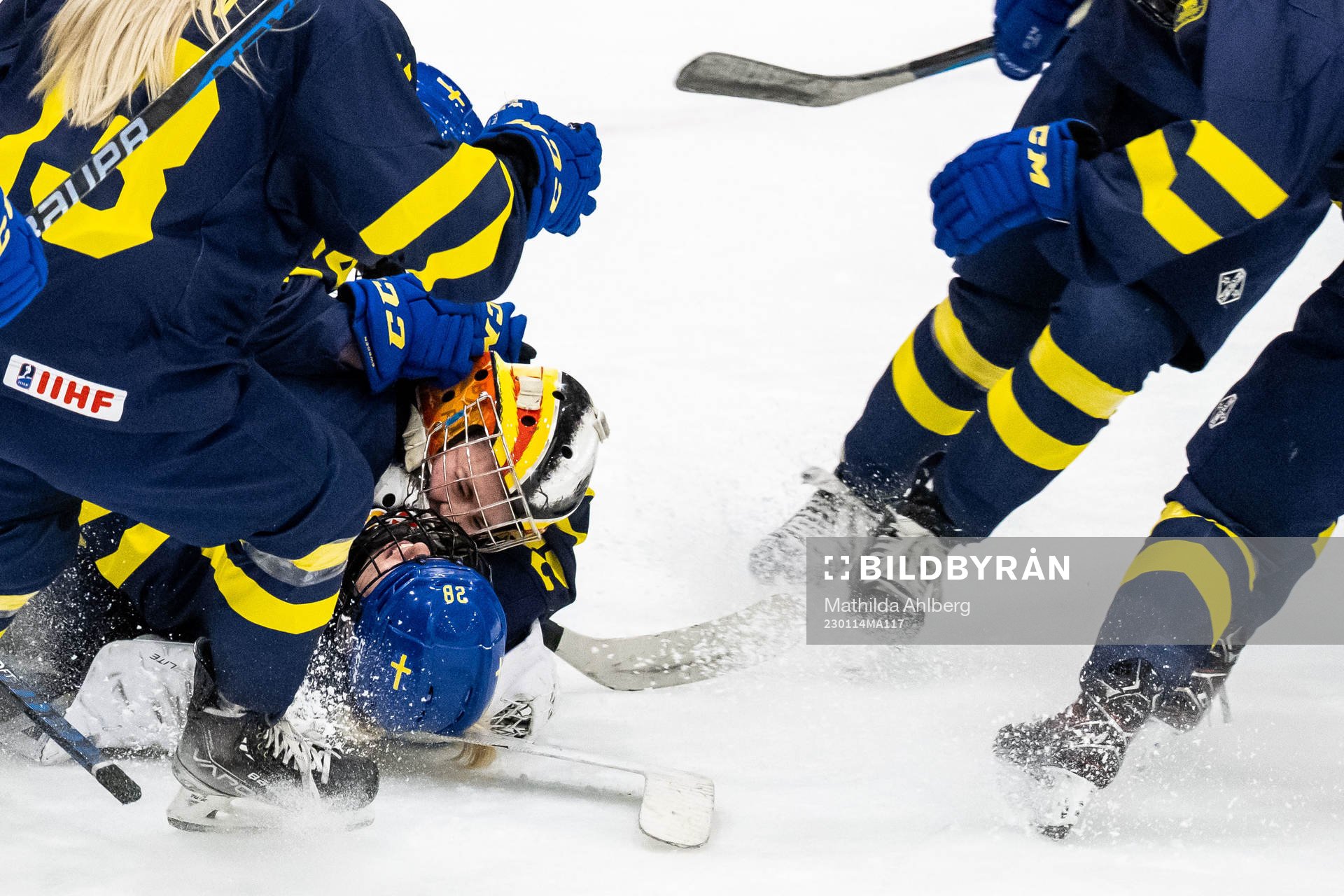 Moa Gustafsson and goaltender Felicia Frank of Sweden
