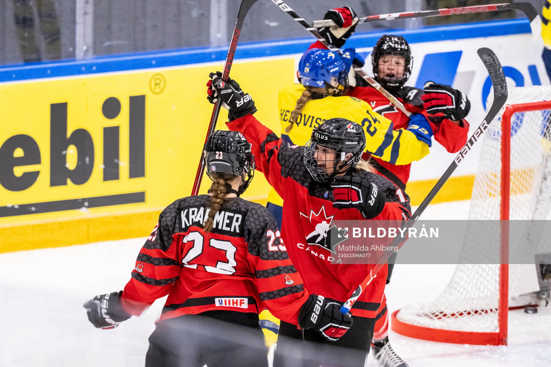 Caitlin Kraemer and Alex Law of Canada celebrate