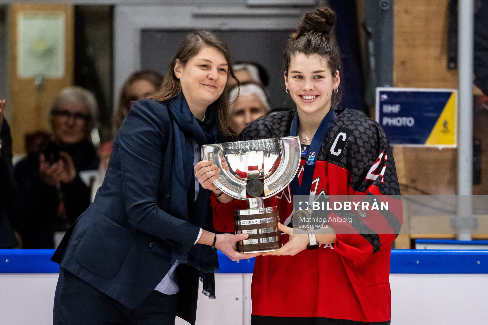 Jocelyn Amos of Canada receives the first place trophy