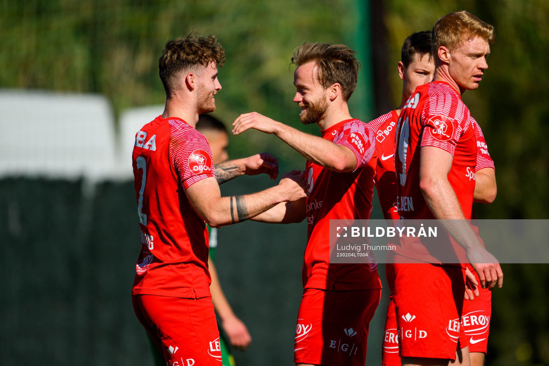 Ole Didrik Blomberg of Brann celebartes with his teammates