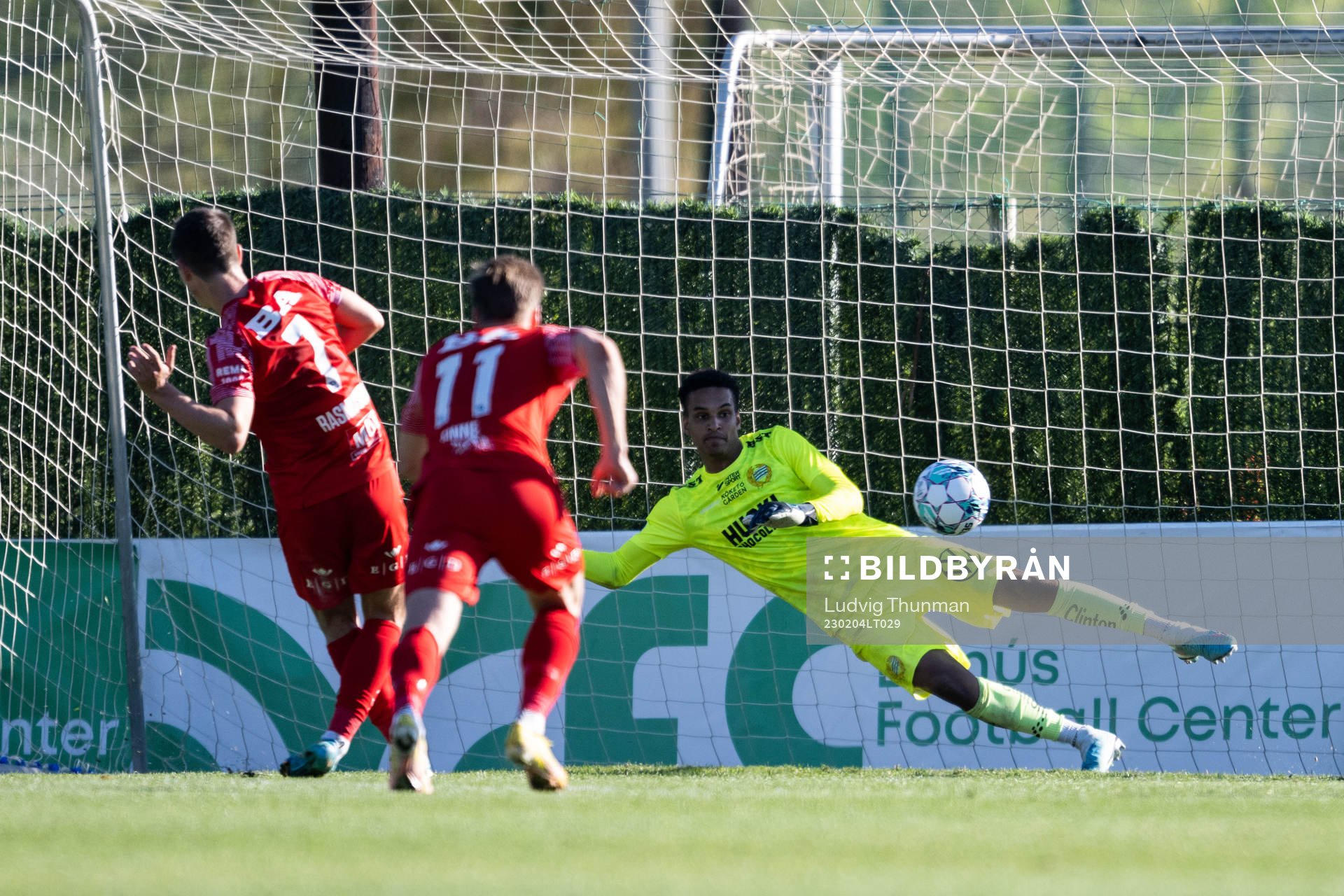 Mathias Rasmussen of Brann scores behind goalkeeper Oliver