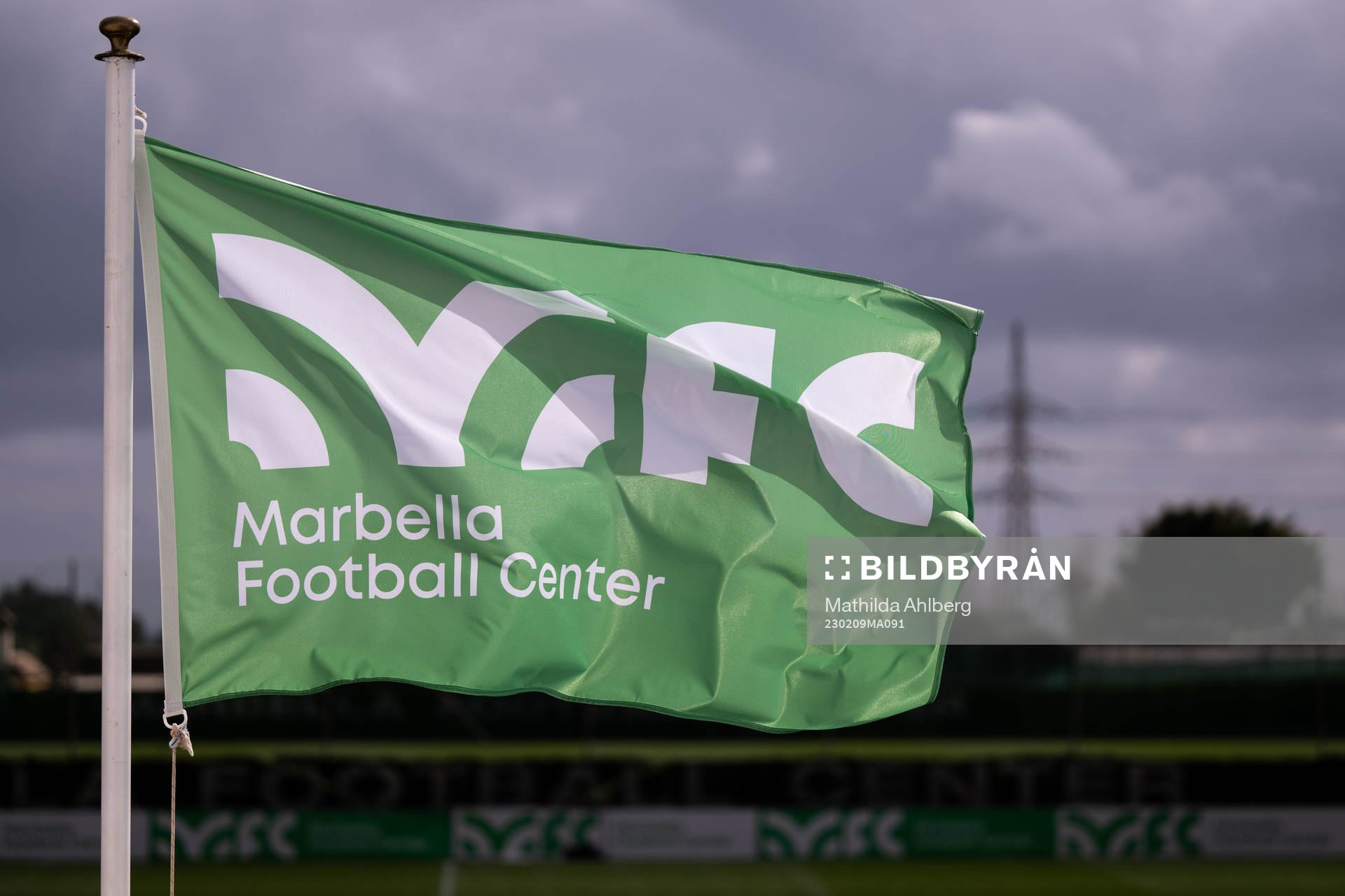 Flags with the Marbella Football Center logo