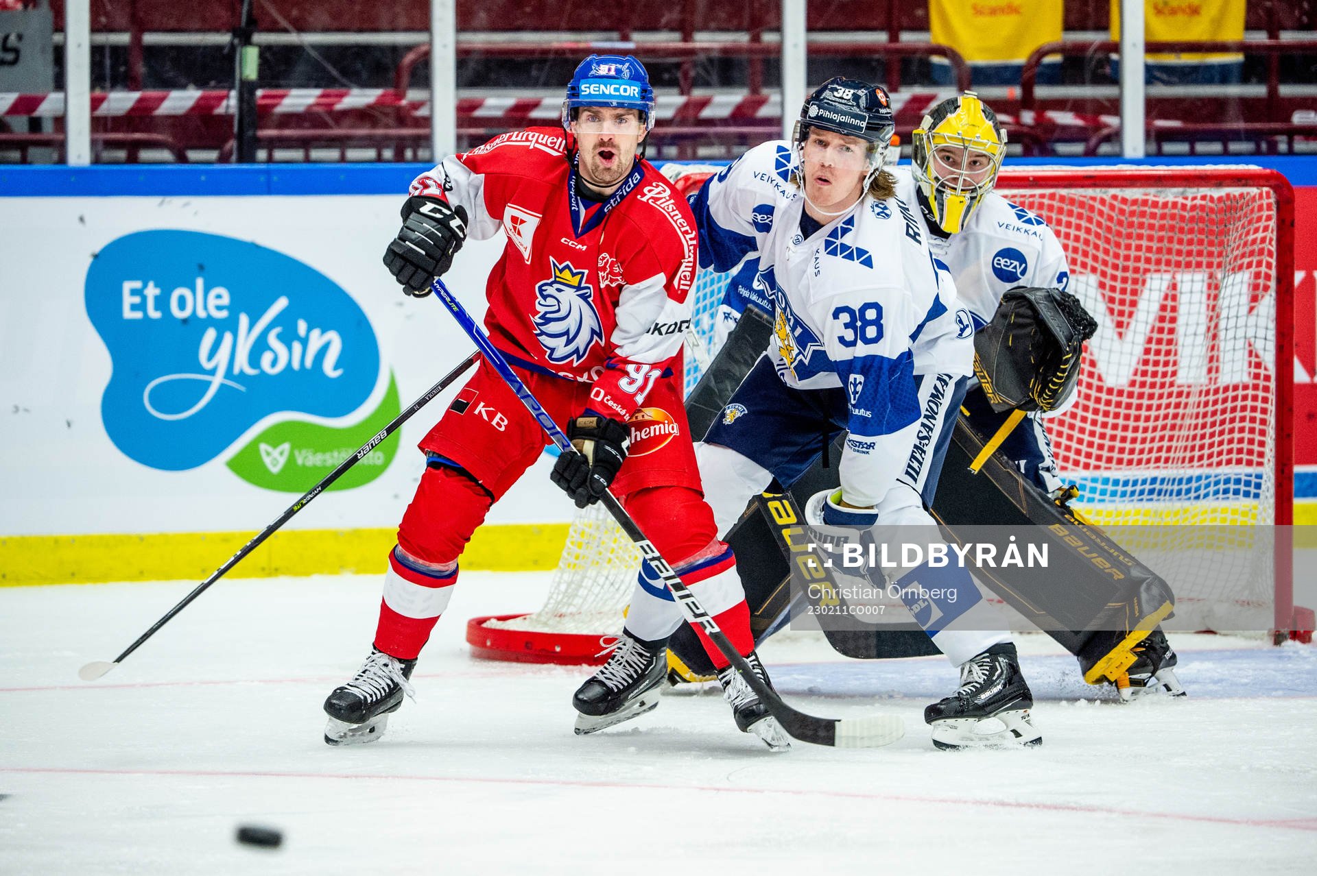 Jakub Flek of Czechia and Juuso Riikola and goaltender Juha