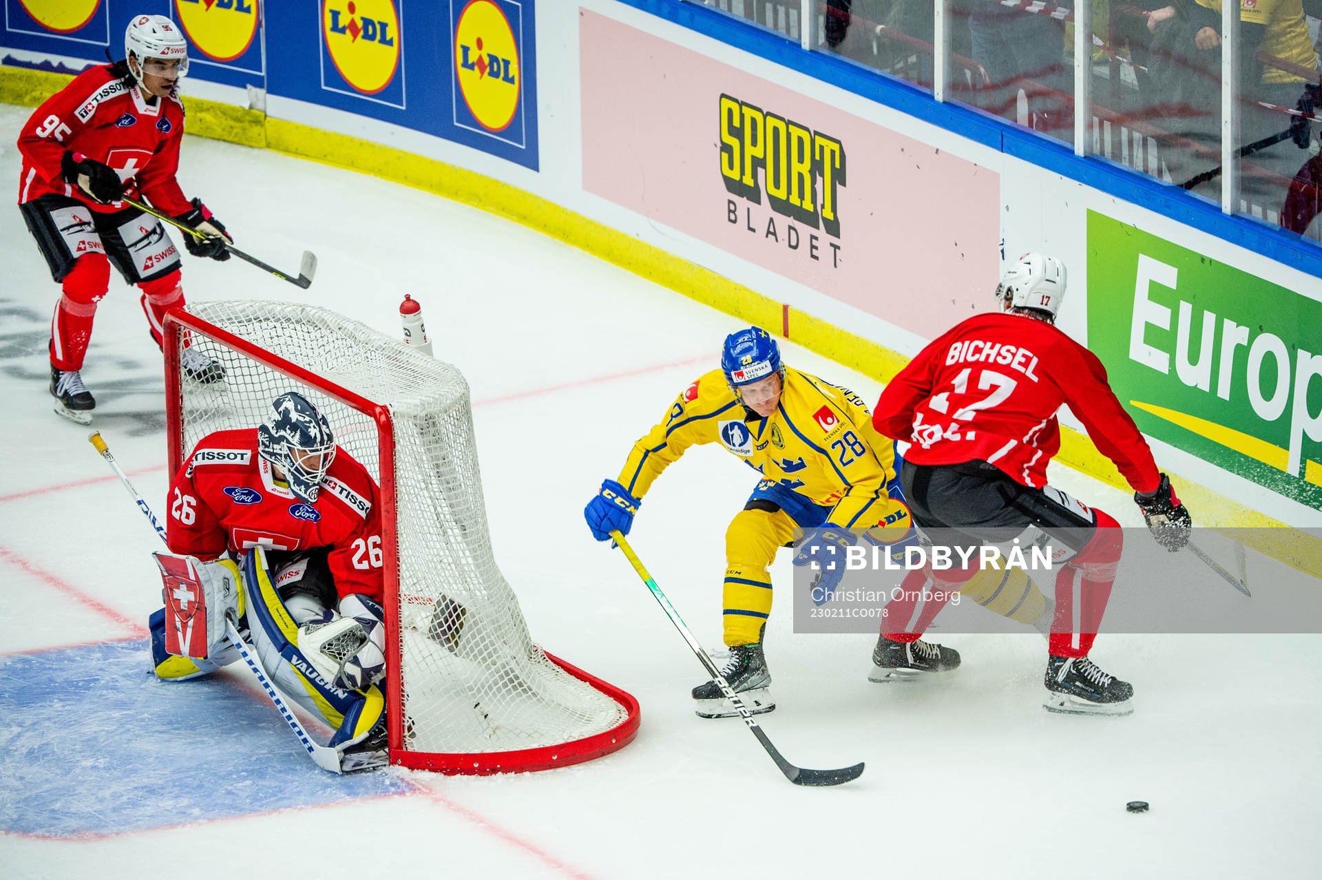 Anton Bengtsson of Sweden and goaltender Sandro Aeschlimann