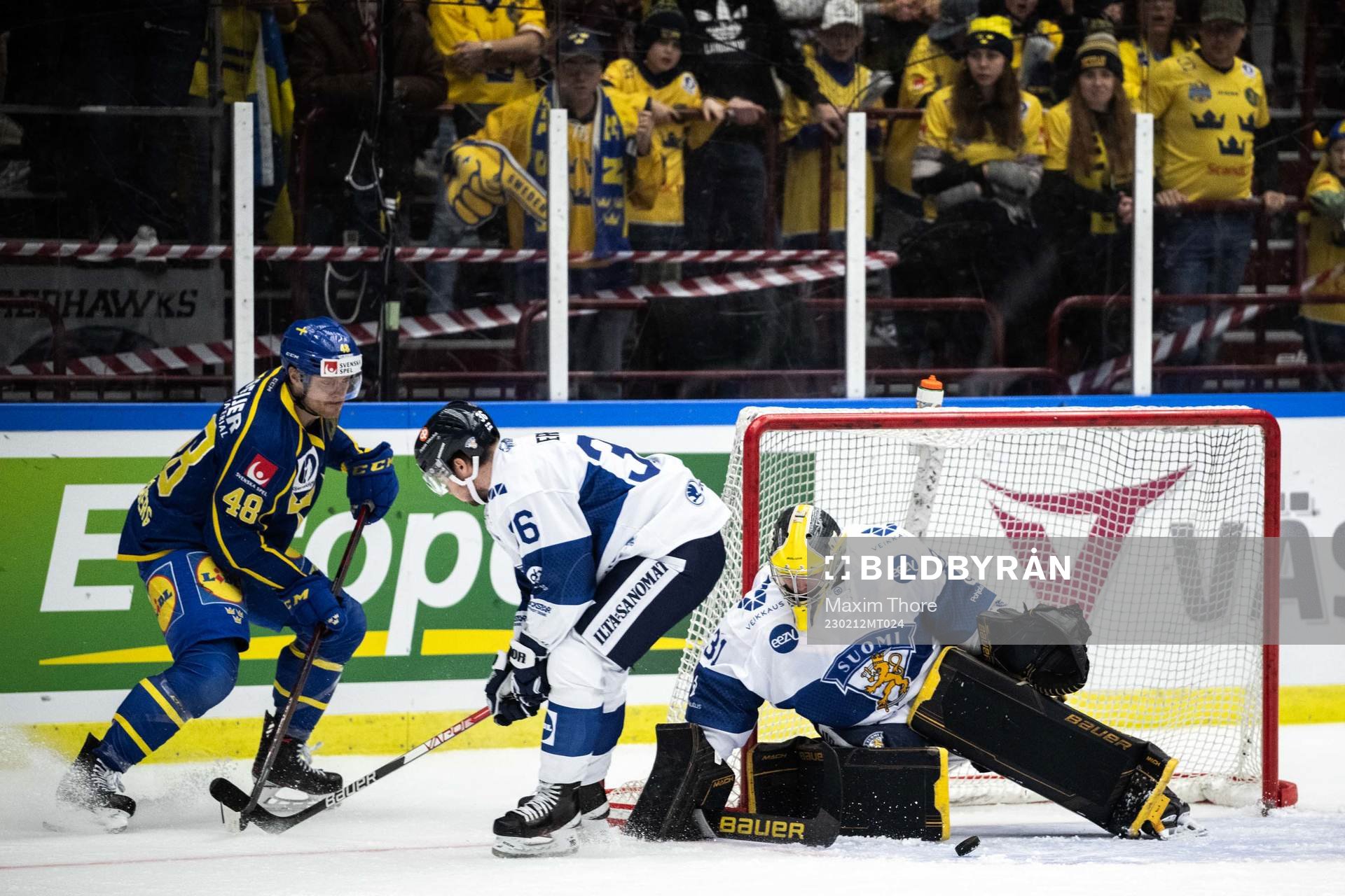 Carl Klingberg of Sweden and goaltender Juha Jatkola of