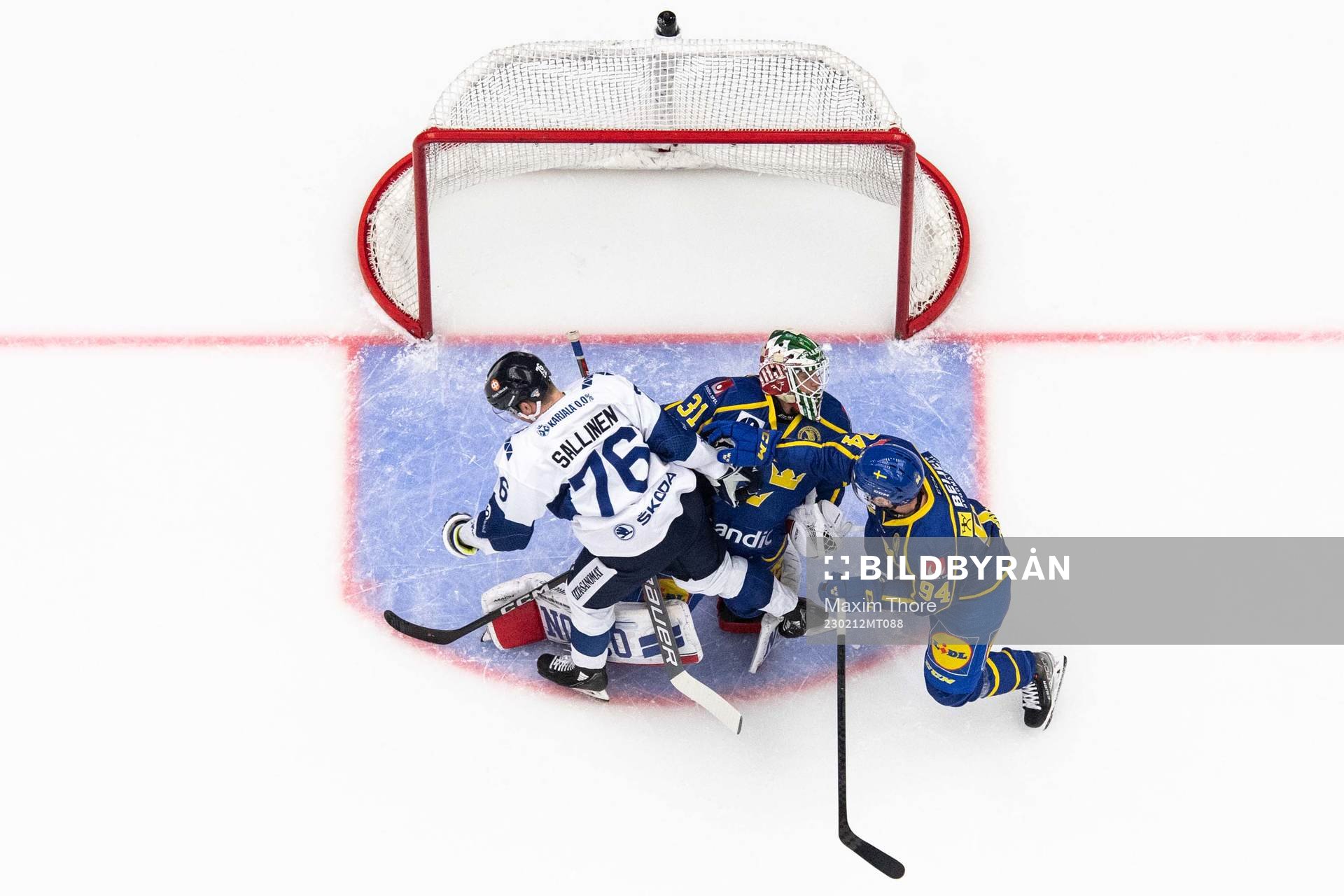Jere Sallinen of Finland, goaltender Lars Johansson and