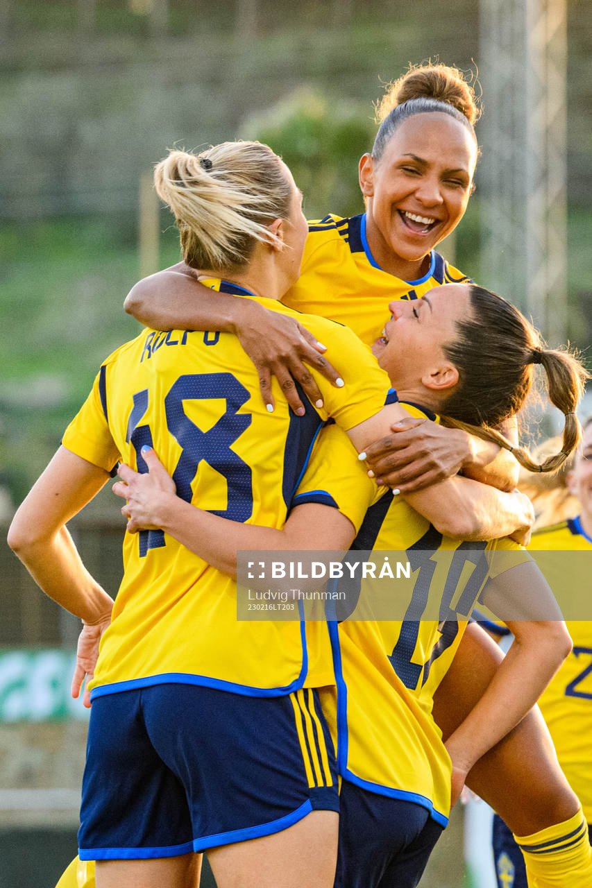Johanna Rytting Kaneryd is hugged by Fridolina Rolfö and