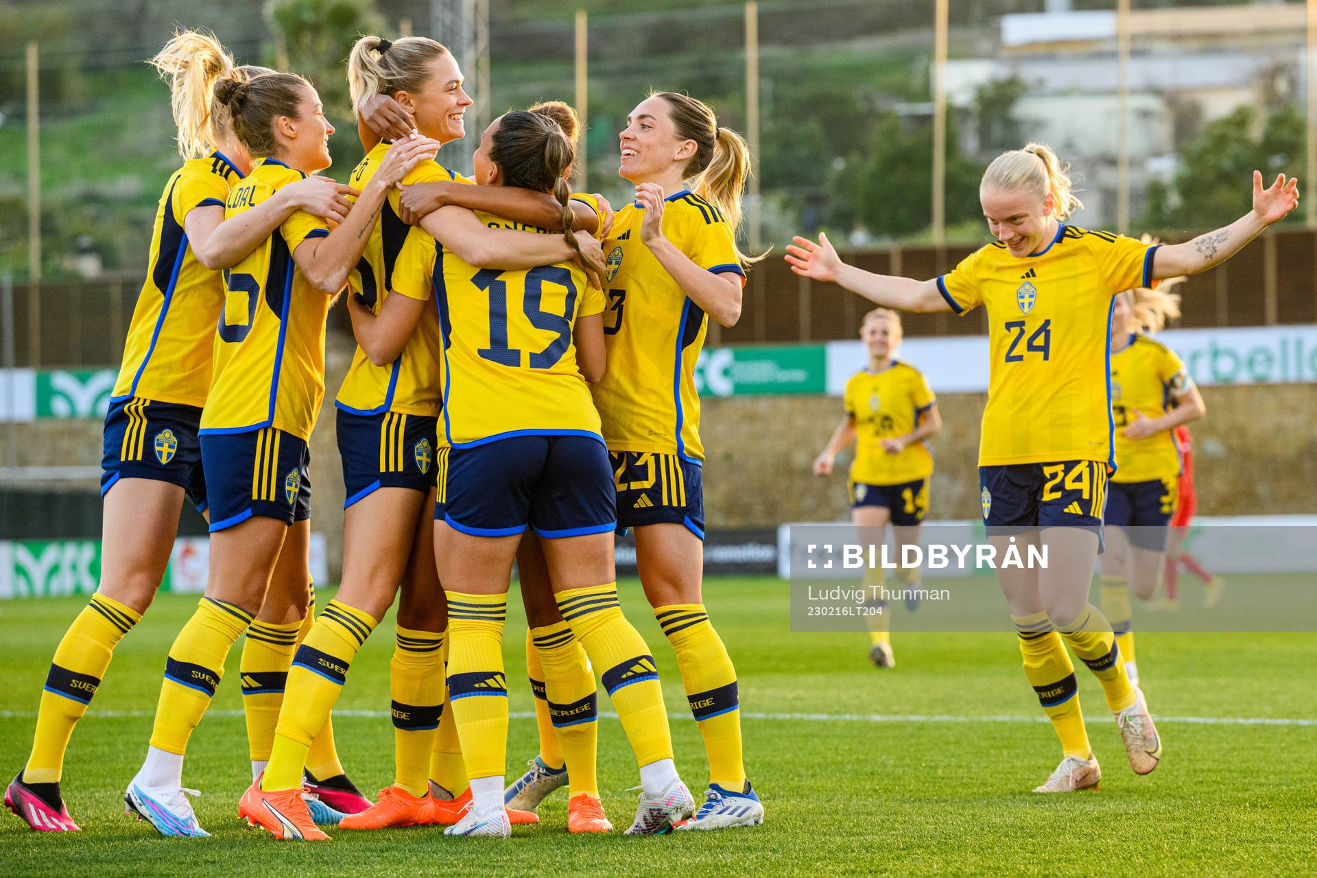 Johanna Rytting Kaneryd is hugged by her teammates of Sweden