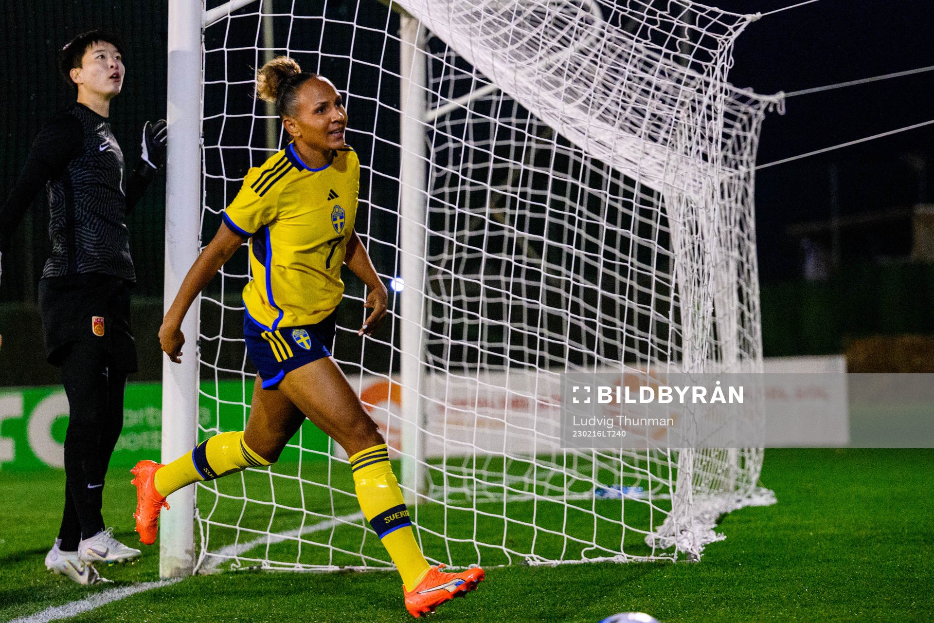 Madelen Janogy of Sweden and goalkeeper Zhu Yu of China