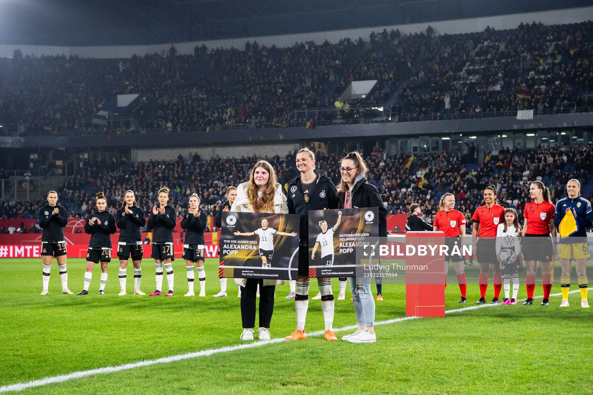 Alexandra Popp of Germany receives an award