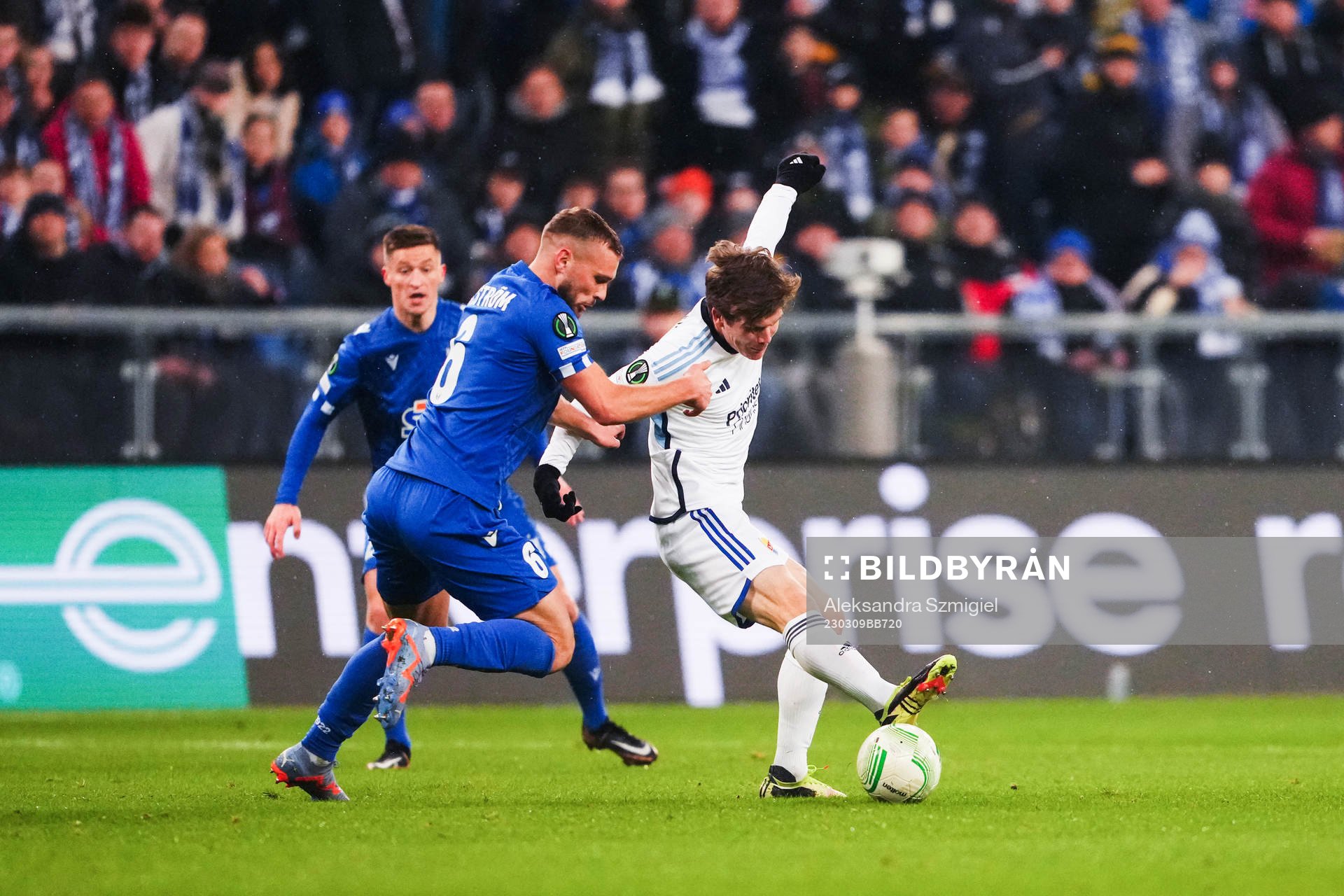 Jesper Karlström of Lech Poznan and Oliver Berg of Djurgården during the UEFA Conference League round of 16 match between Lech Poznan and Djurgården on March 9, 2023 in Poznan.