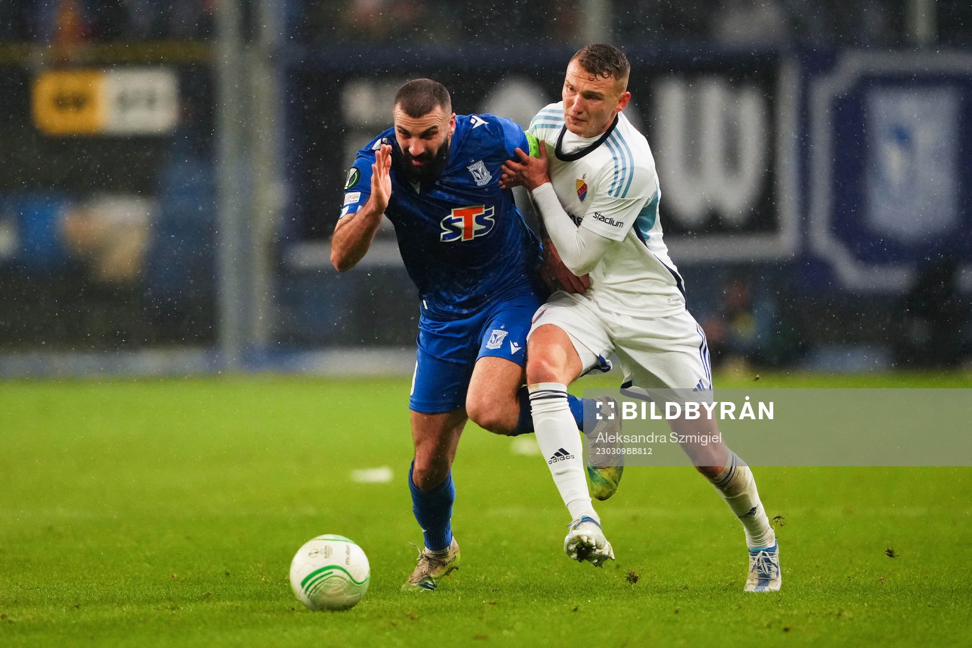 Mikael Ishak of Lech Poznan and Piotr Johansson of