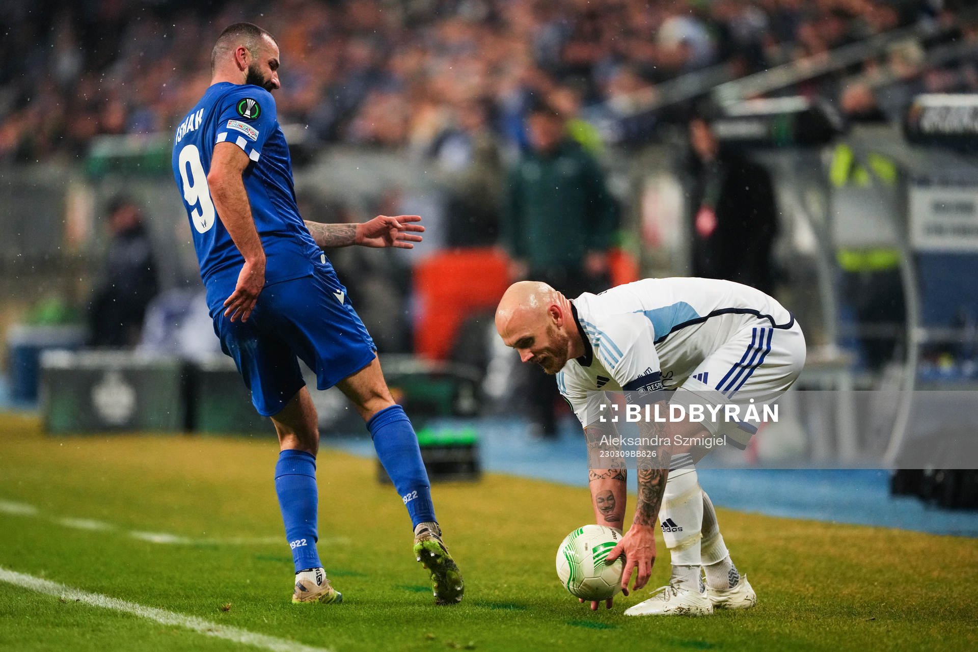 Mikael Ishak of Lech Poznan and Magnus Eriksson of