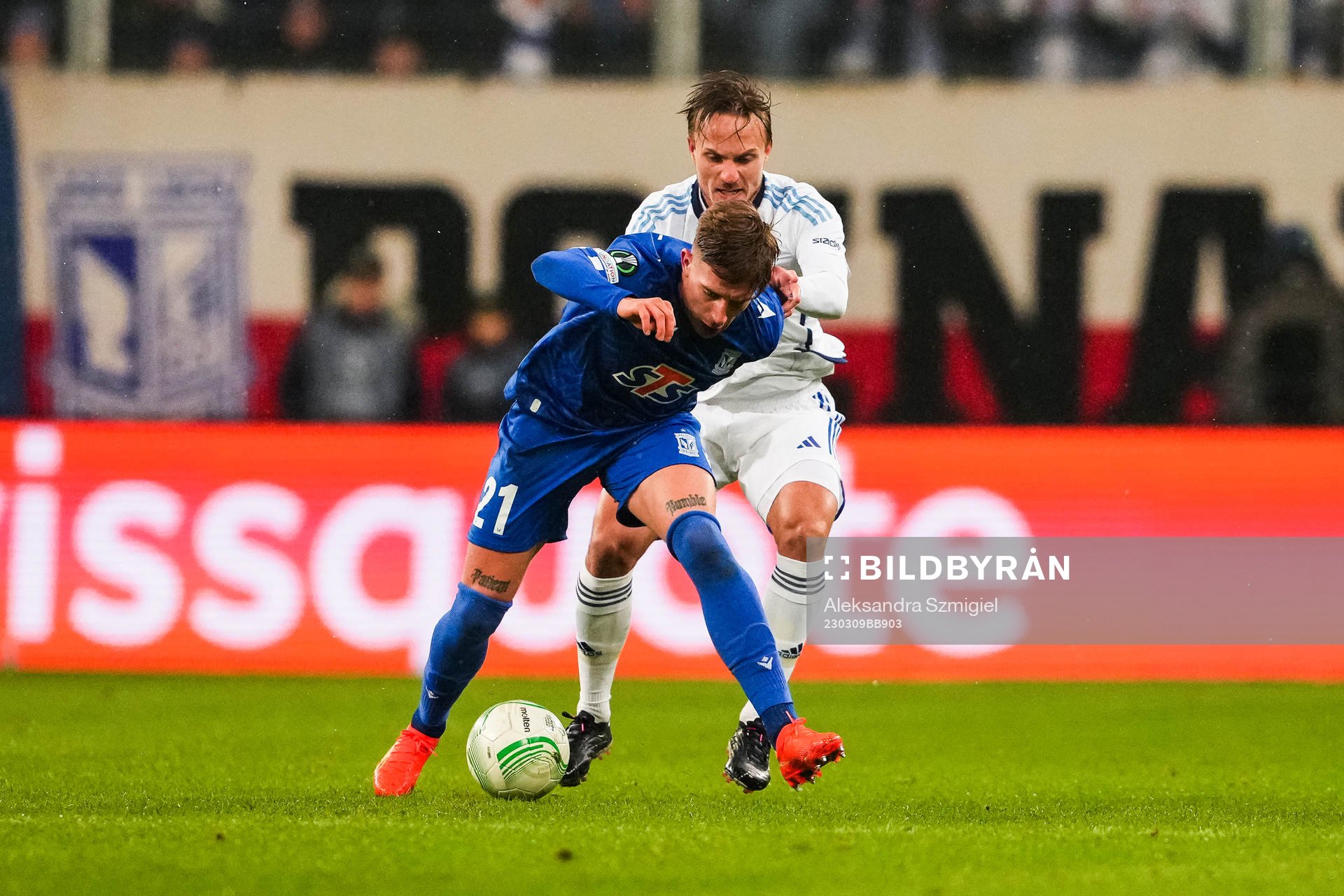 Michal Skoras of Lech Poznan and Pierre Neurath Bengtsson of Djurgården during the UEFA Conference League round of 16 match between Lech Poznan and Djurgården on March 9, 2023 in Poznan.